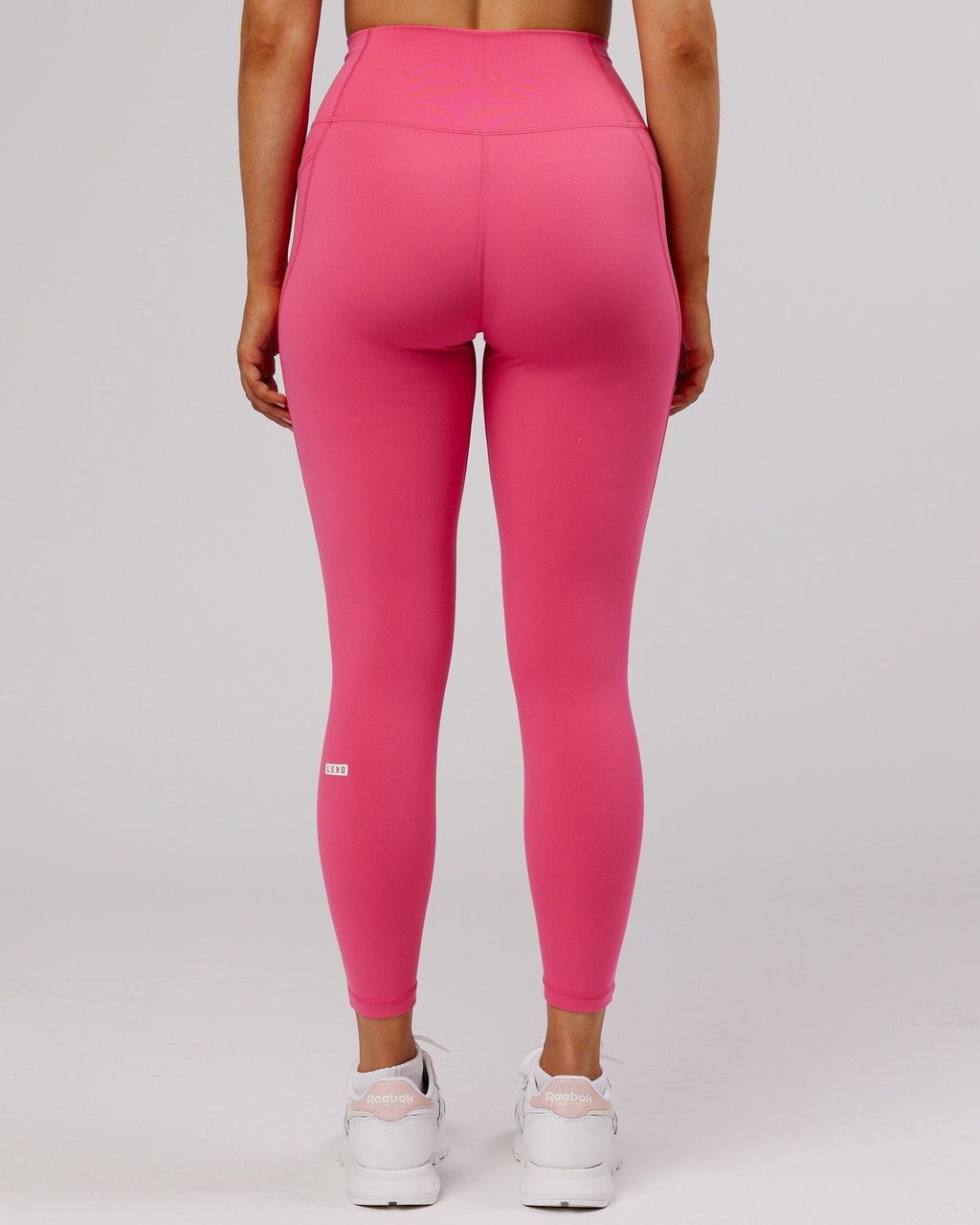 Model wearing Fusion 7/8 Length Tight - Flamingo