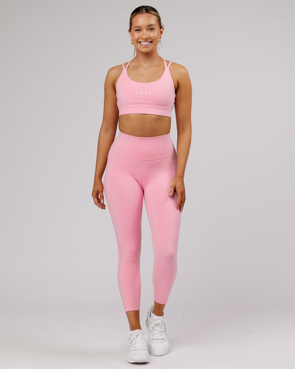 Model wearing Fusion 7/8 Length Tight - Pink Frosting
