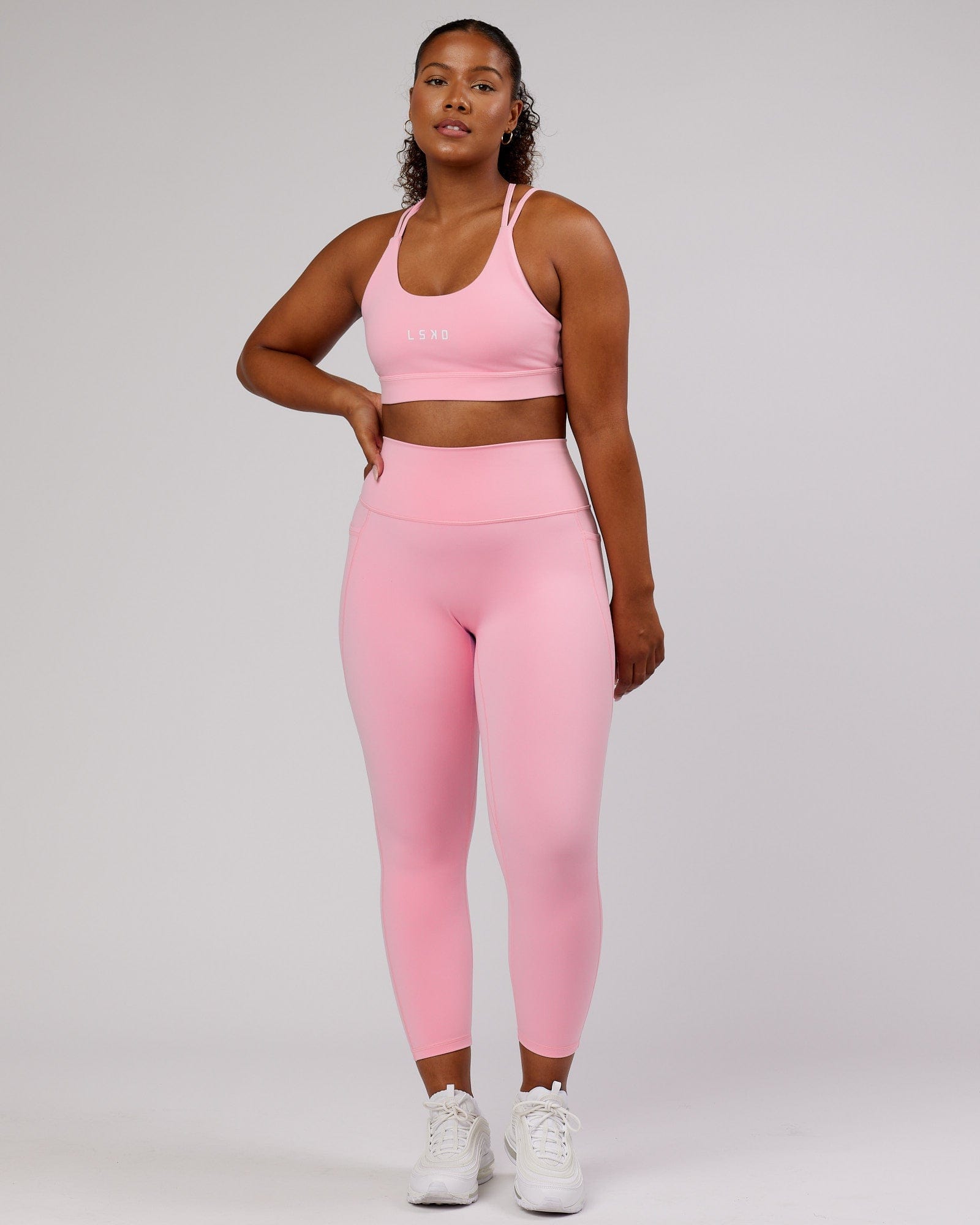 Model wearing Fusion 7/8 Length Tight - Pink Frosting