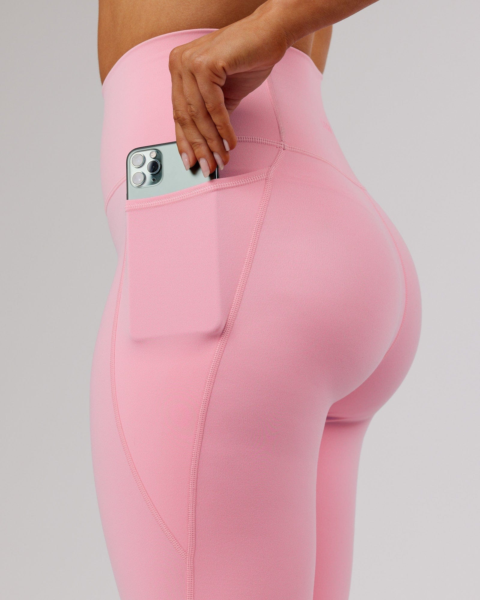 Model wearing Fusion 7/8 Length Tight - Pink Frosting