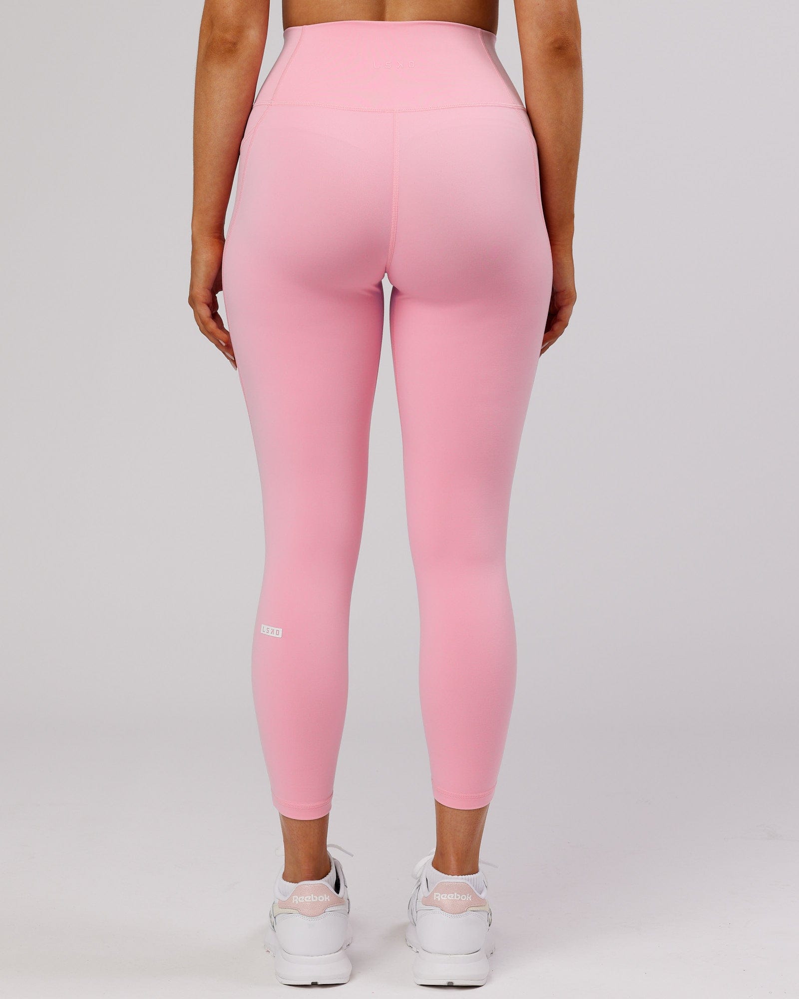 Model wearing Fusion 7/8 Length Tight - Pink Frosting