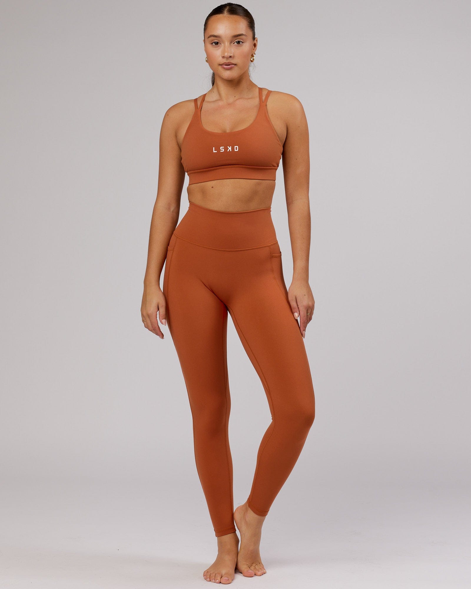 Model wearing Fusion Full Length Tight - Auburn