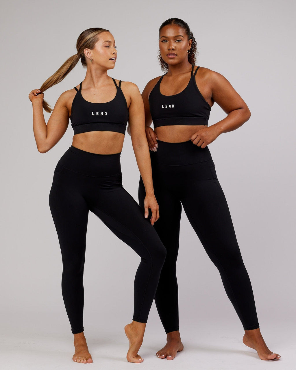 Model wearing Fusion Full Length Tight - Black-Flamingo