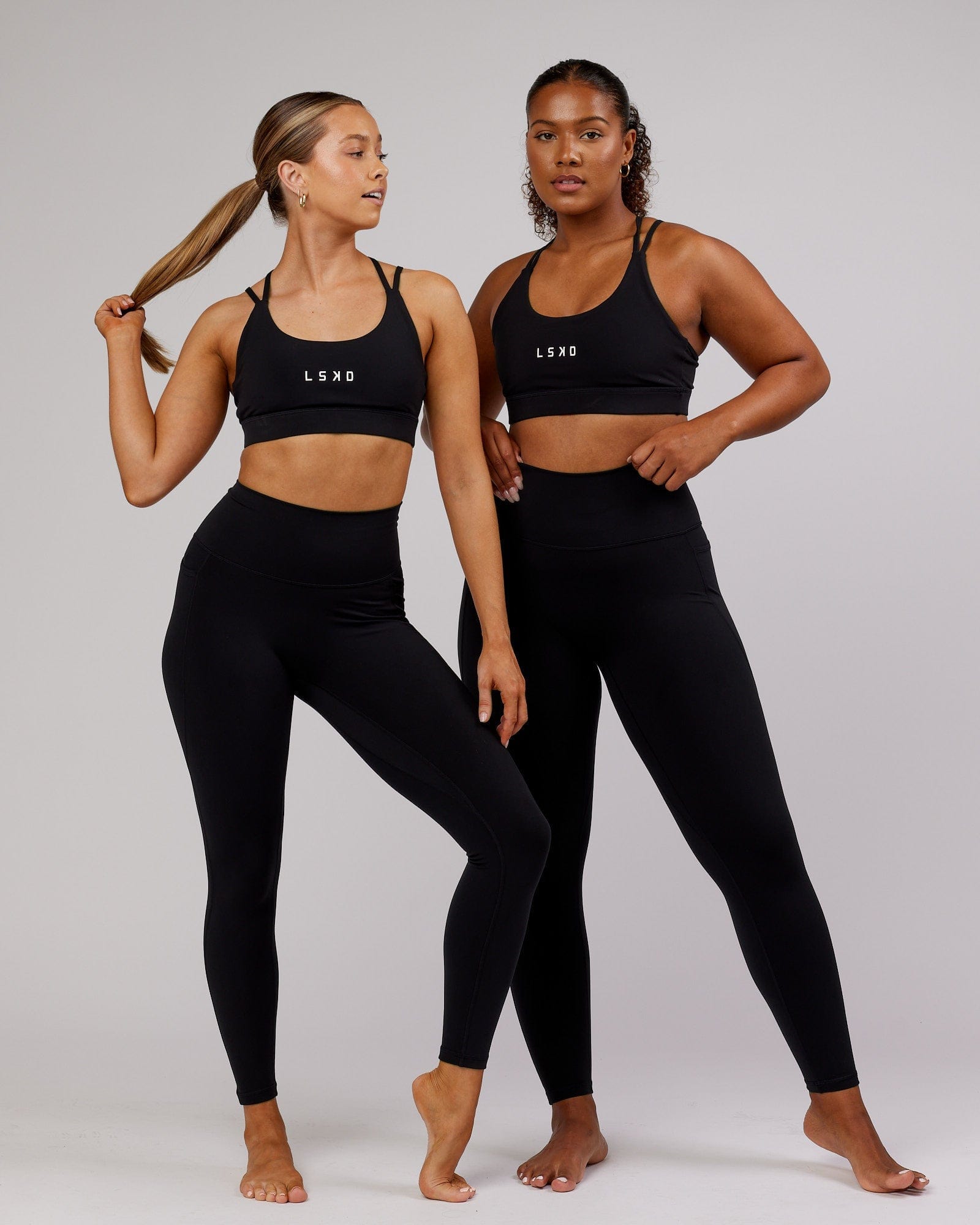 Model wearing Fusion Full Length Tight - Black-Flamingo