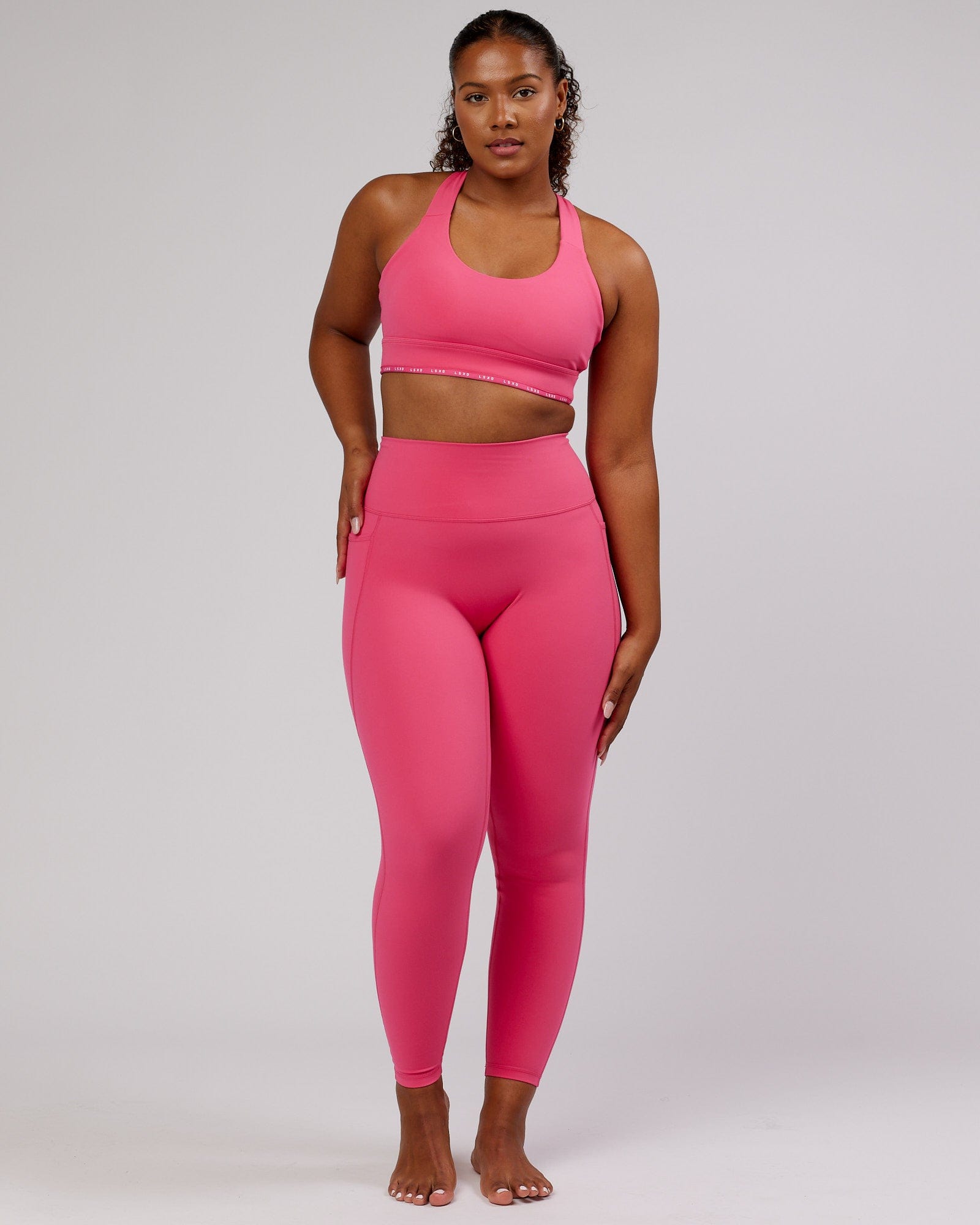 Model wearing Fusion Full Length Tight - Flamingo