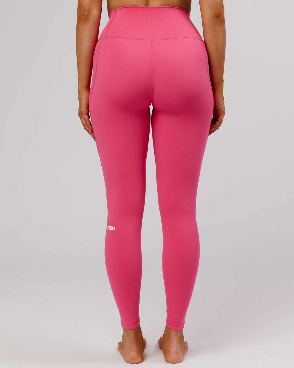 Model wearing Fusion Full Length Tight - Flamingo