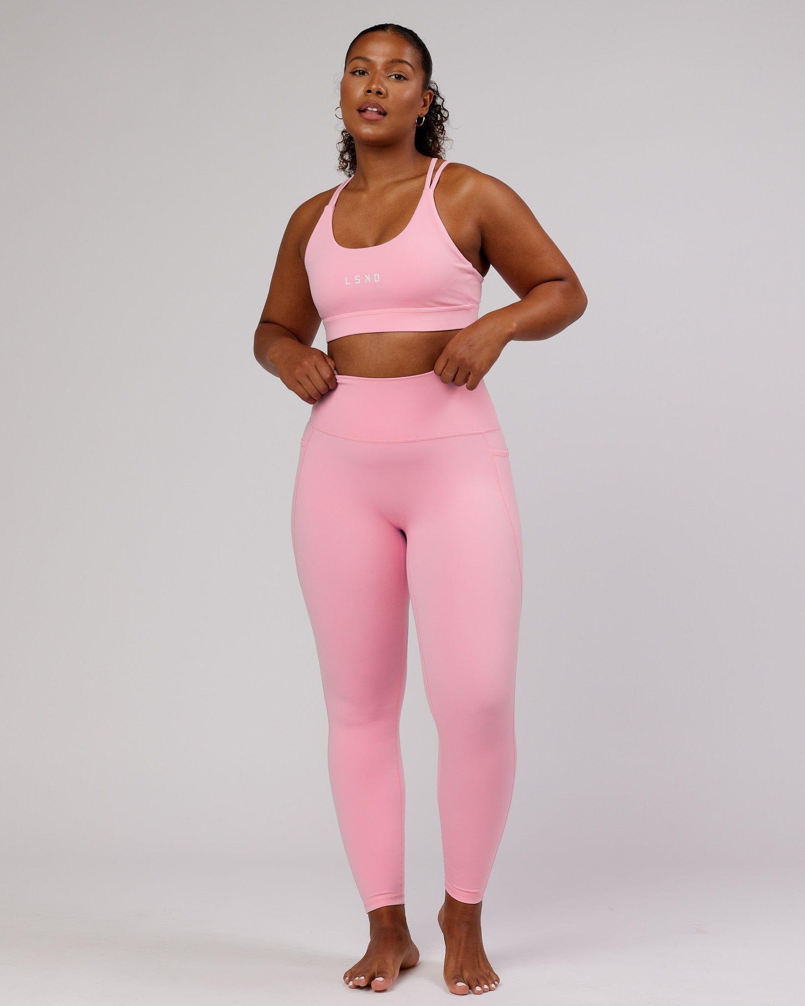 Model wearing Fusion Full Length Tight - Pink Frosting