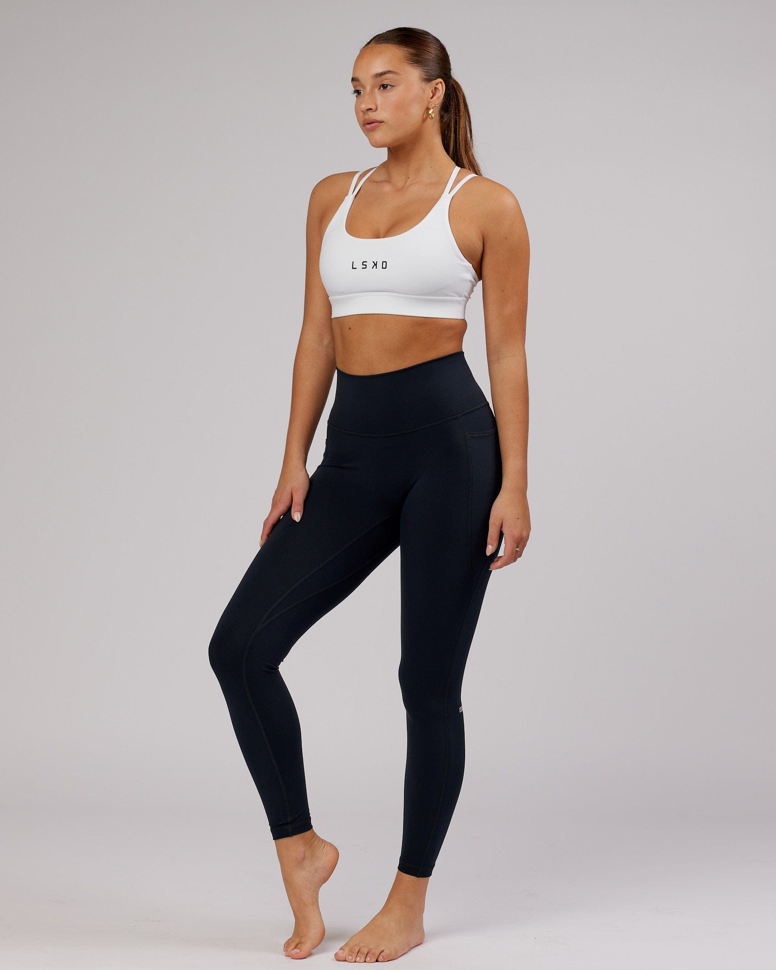 Model wearing Fusion Full Length Tight - Navy