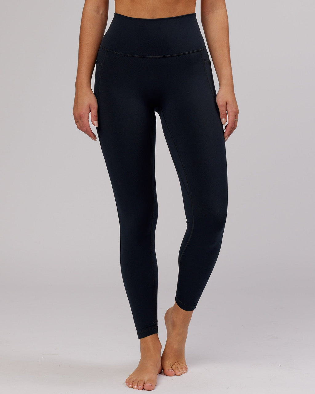 Model wearing Fusion Full Length Tight - Navy