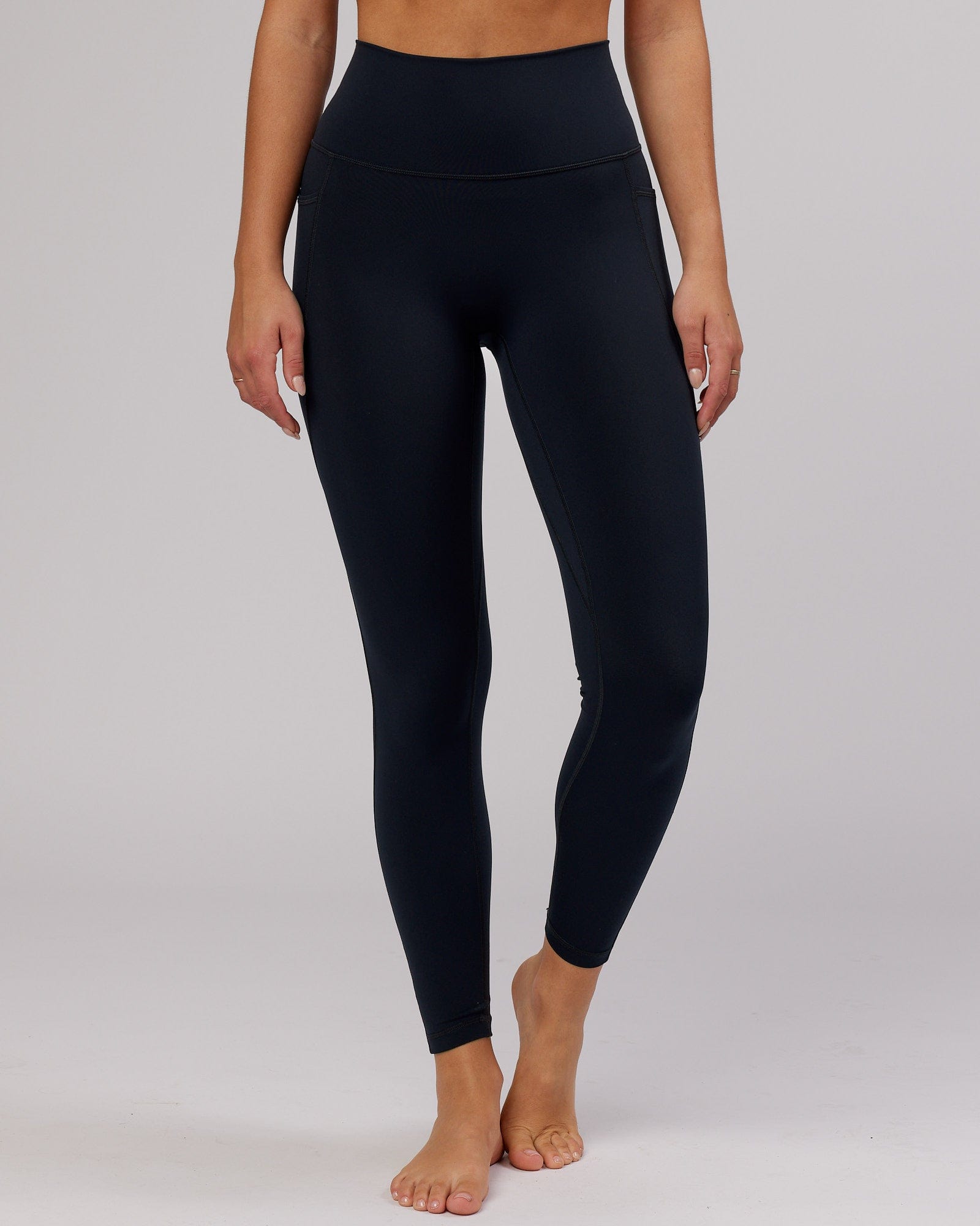 Model wearing Fusion Full Length Tight - Navy