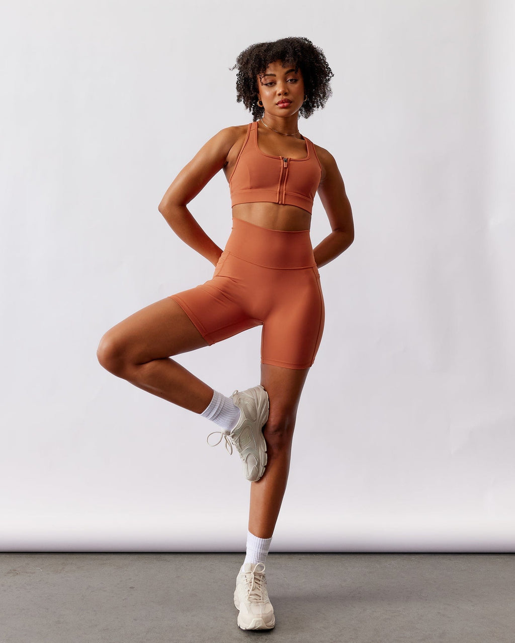 Model wearing Fusion Mid Short Tight - Auburn