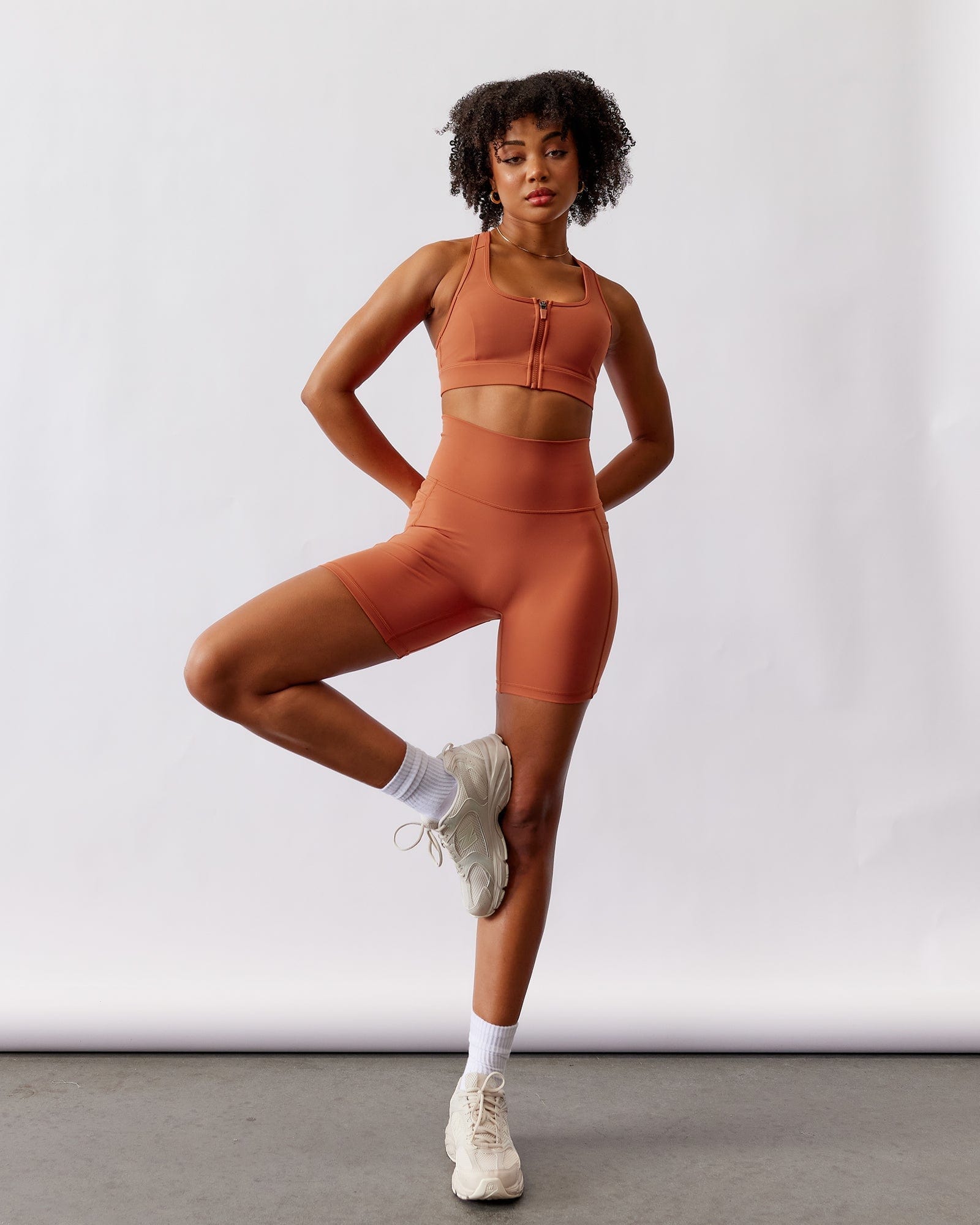 Model wearing Fusion Mid Short Tight - Auburn