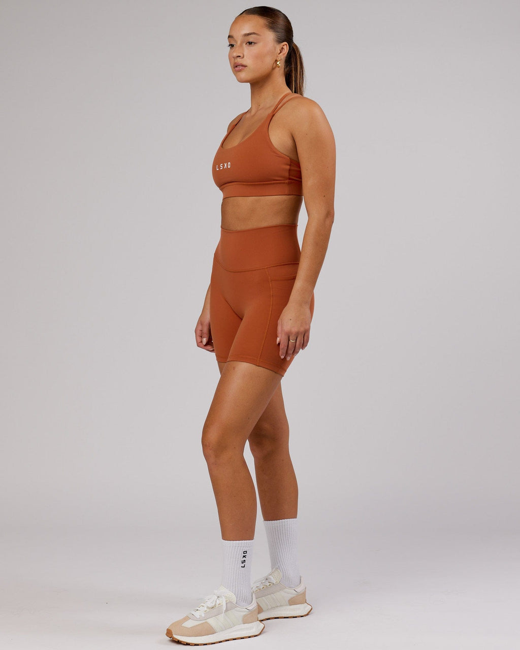 Model wearing Fusion Mid Short Tight - Auburn