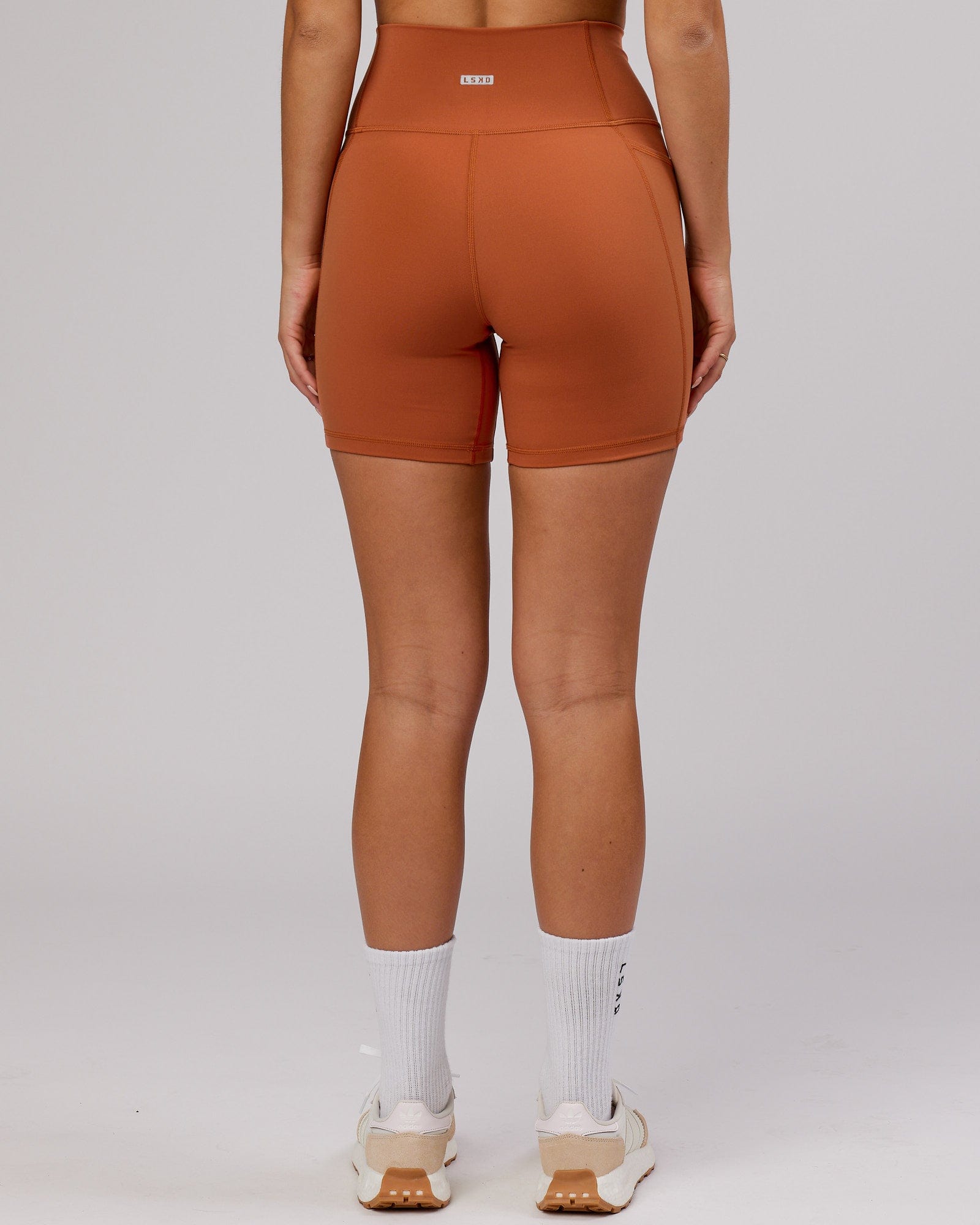 Model wearing Fusion Mid Short Tight - Auburn