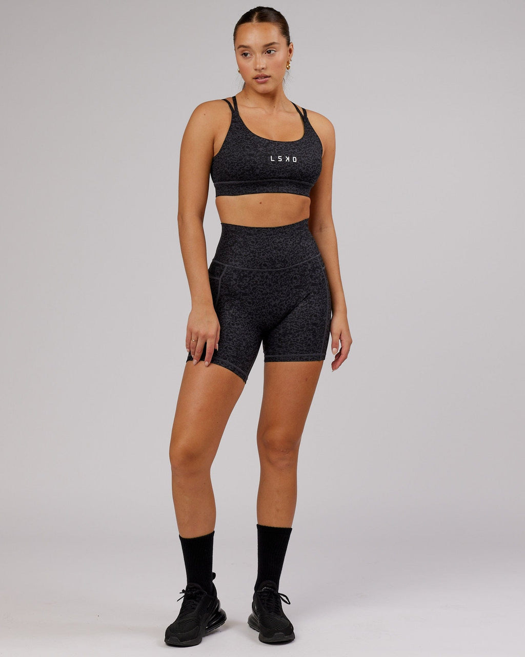 Model wearing Fusion Mid Short Tight - Black Etching