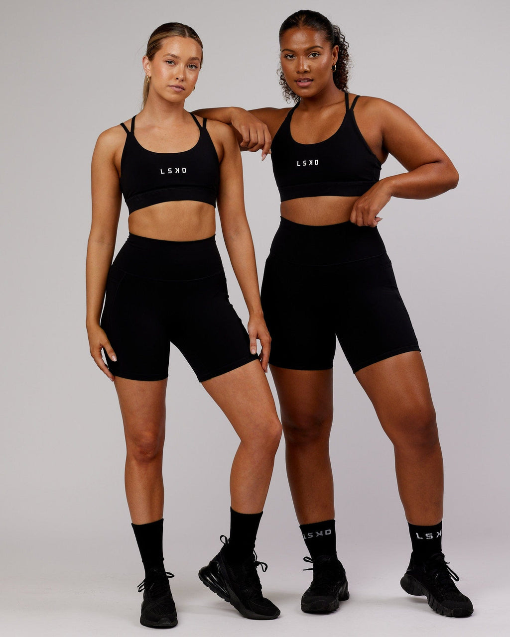 Model wearing Fusion Mid Short Tight - Black-Flamingo