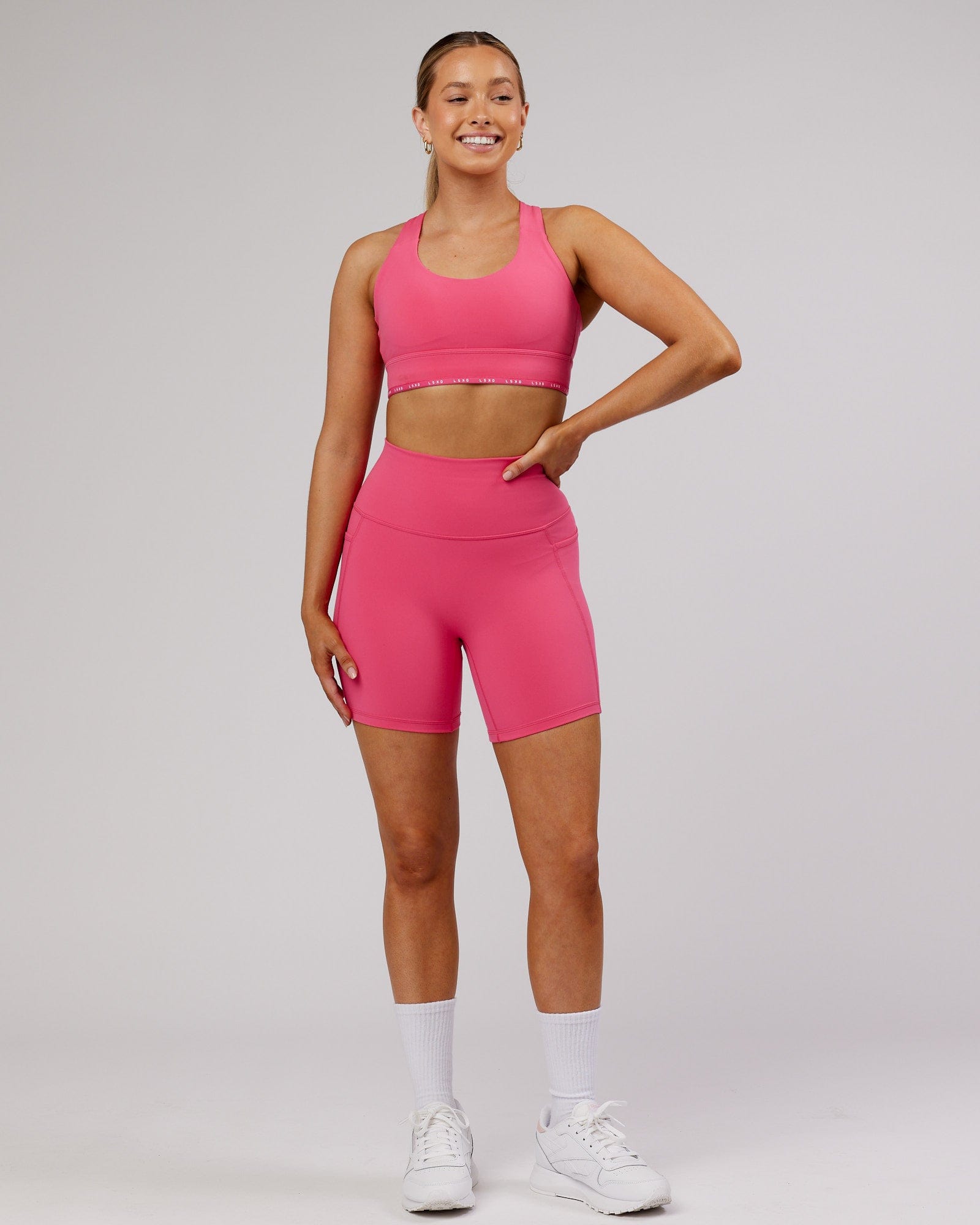 Model wearing Fusion Mid-Short Tight - Flamingo