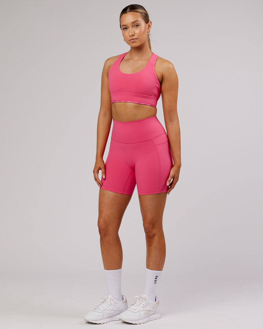 Model wearing Fusion Mid-Short Tight - Flamingo