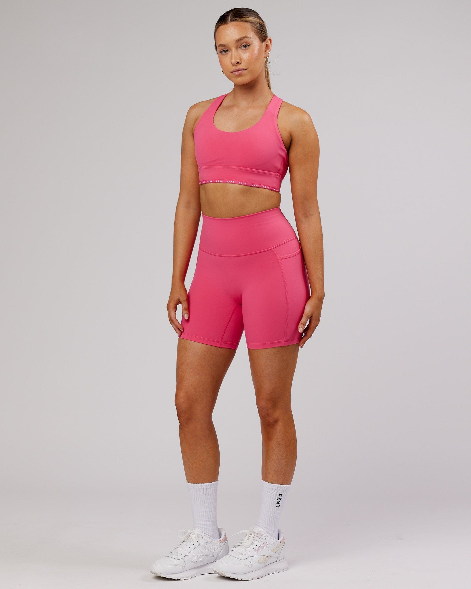 Model wearing Fusion Mid-Short Tight - Flamingo