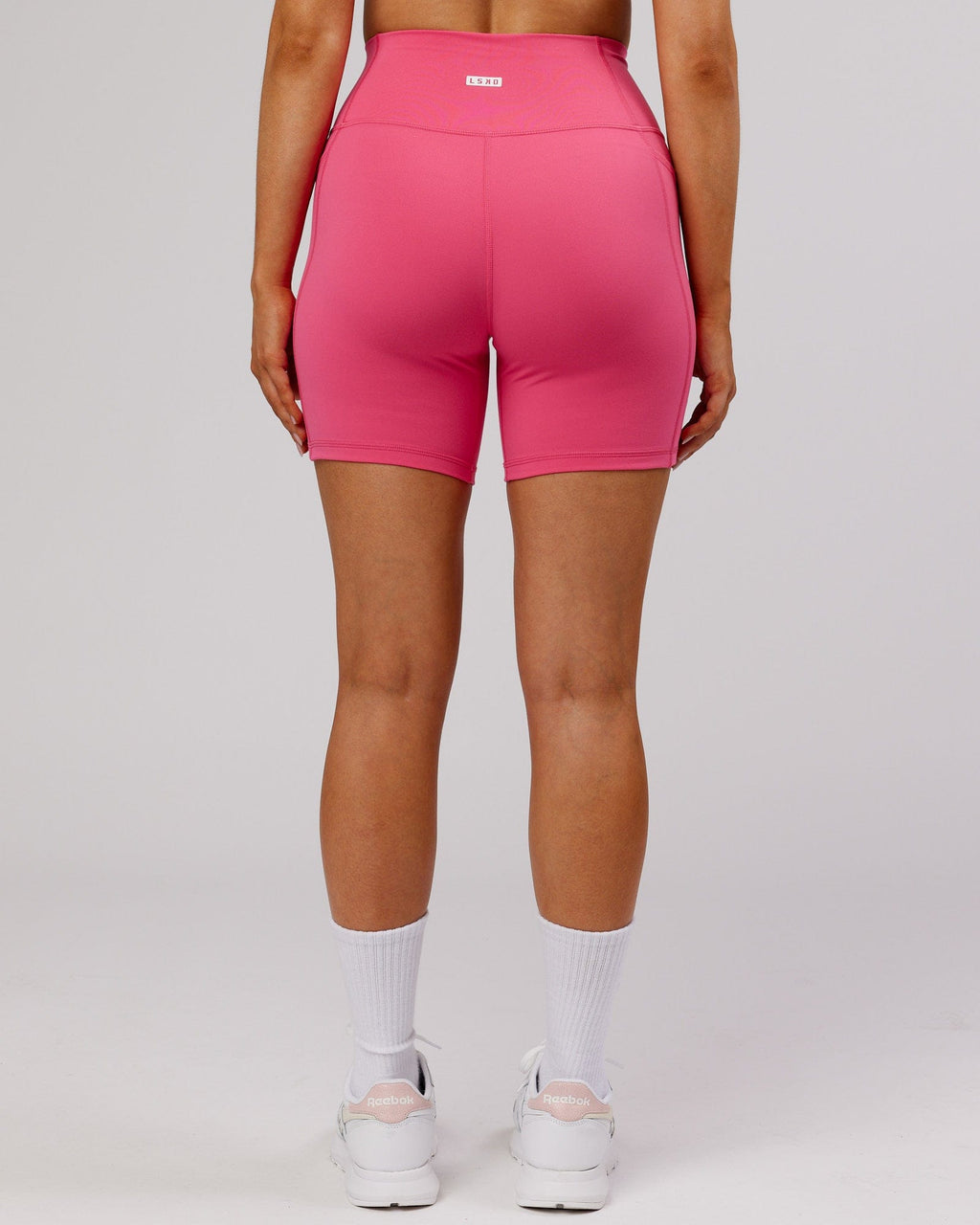 Model wearing Fusion Mid-Short Tight - Flamingo