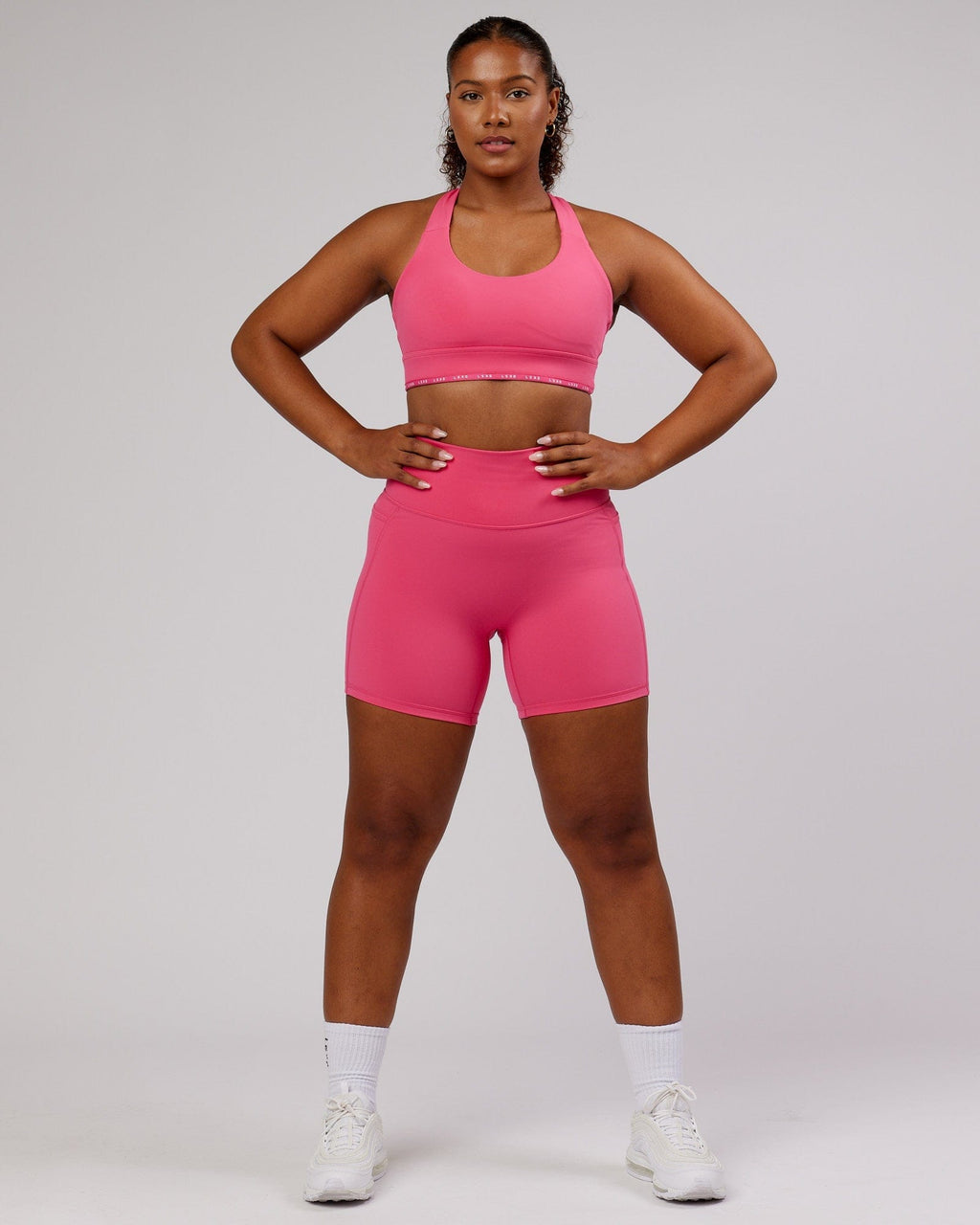 Model wearing Fusion Mid-Short Tight - Flamingo