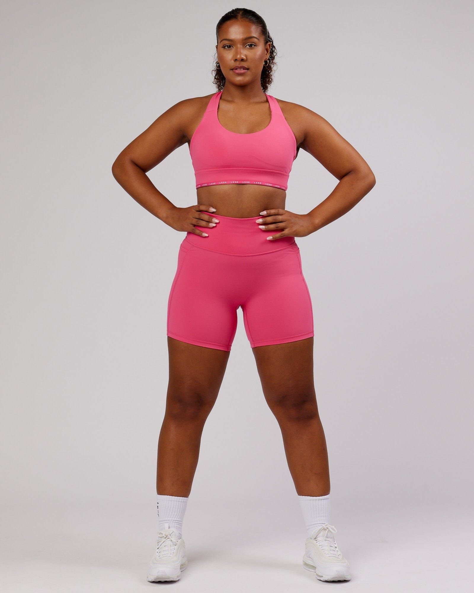 Model wearing Fusion Mid-Short Tight - Flamingo