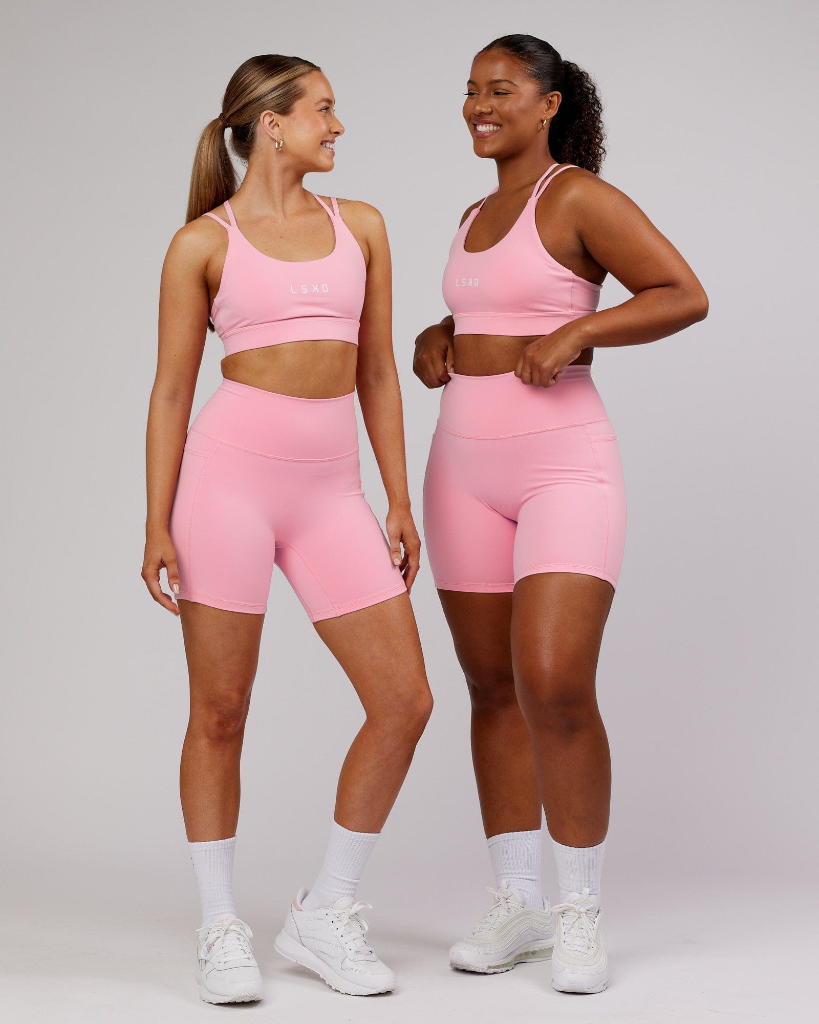 Model wearing Fusion Mid Short Tight - Pink Frosting