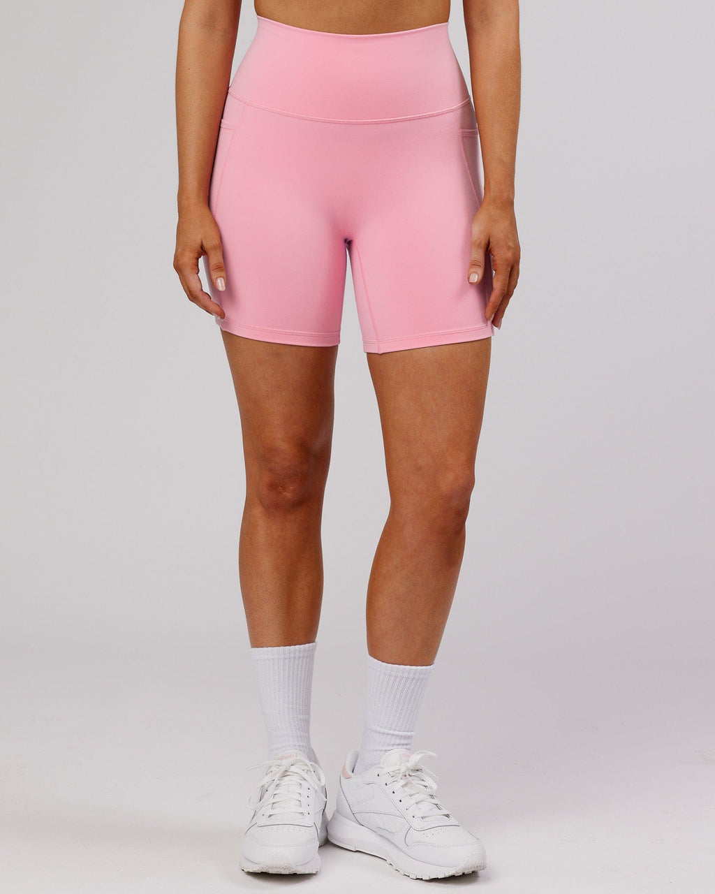 Model wearing Fusion Mid Short Tight - Pink Frosting