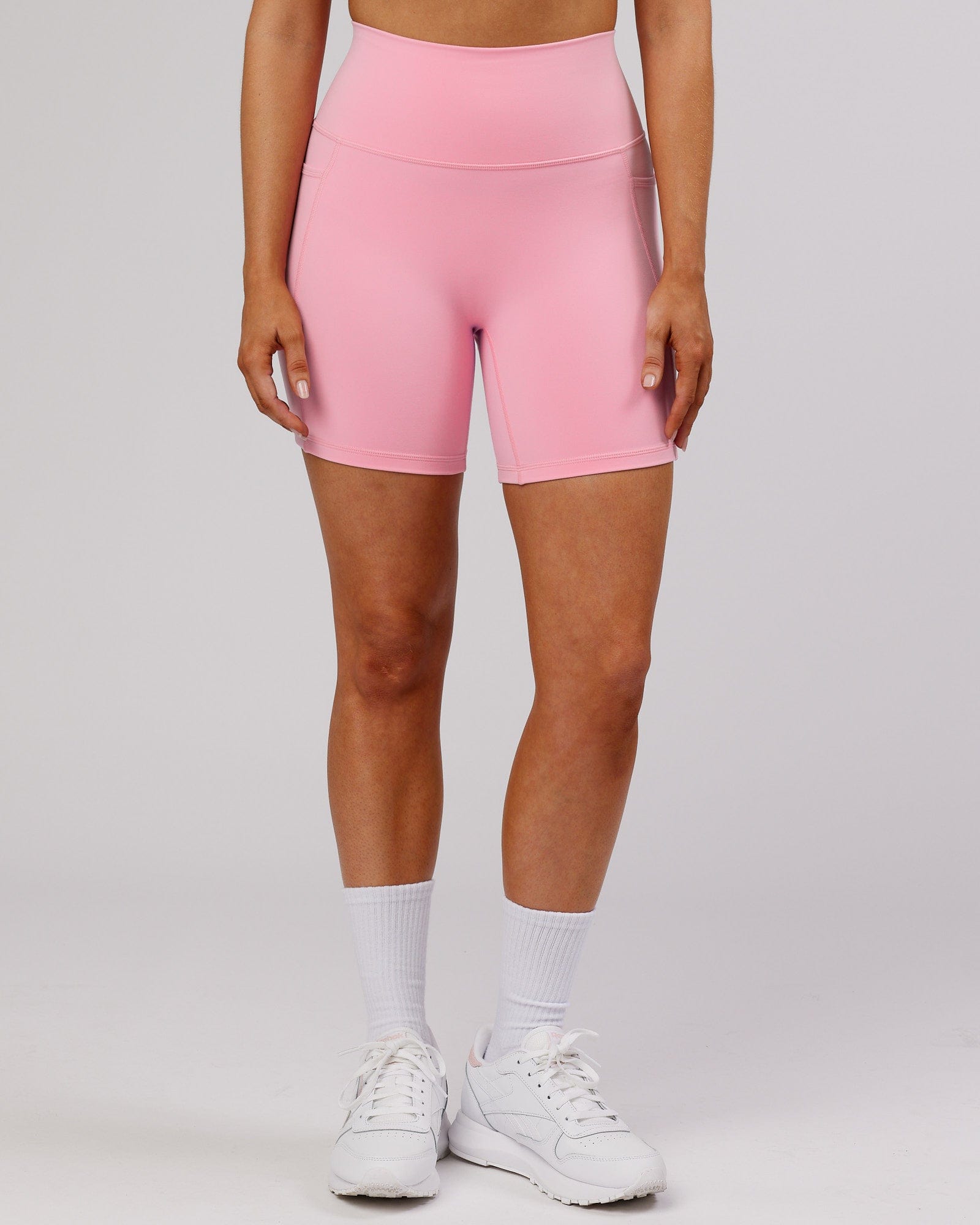 Model wearing Fusion Mid Short Tight - Pink Frosting