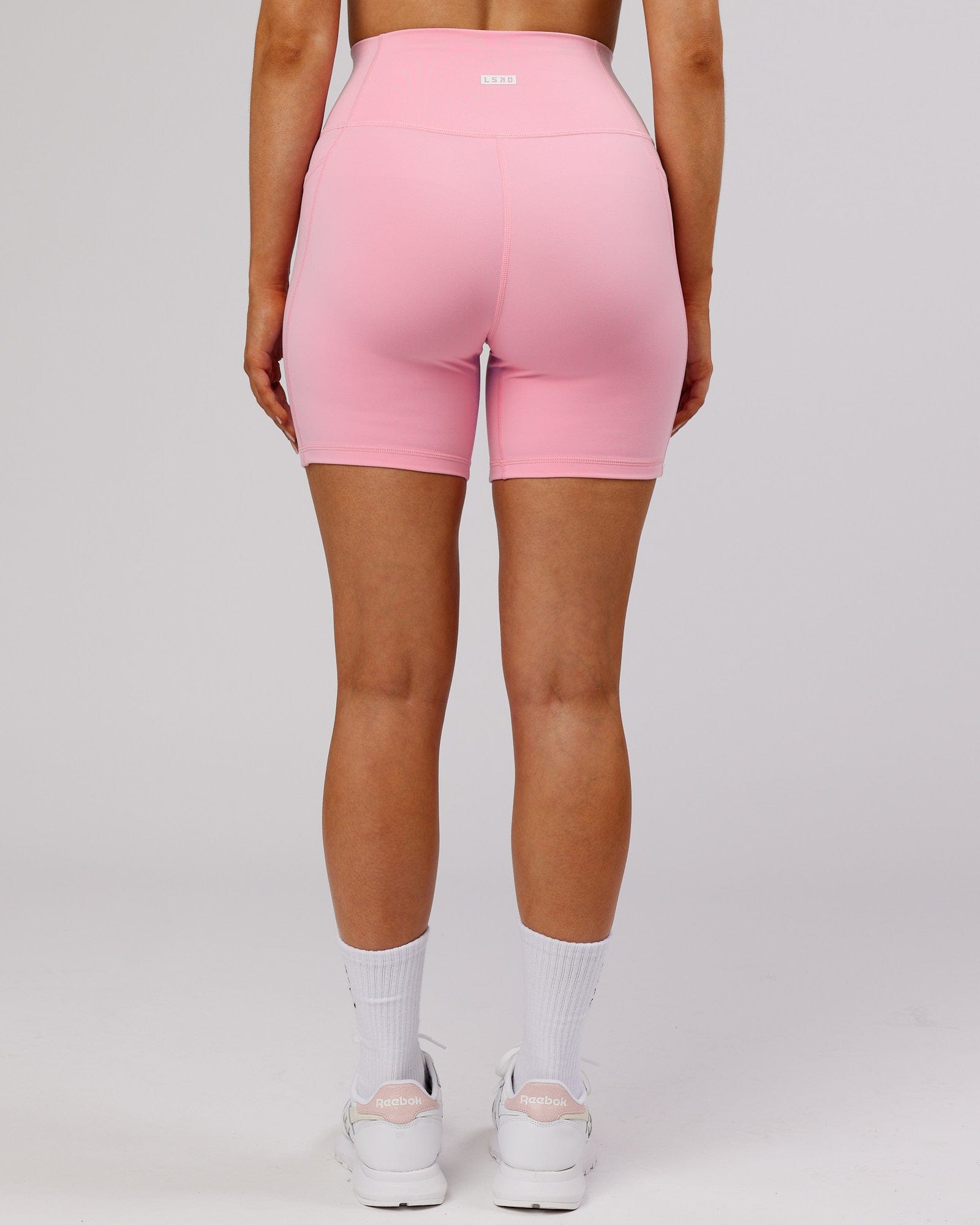 Model wearing Fusion Mid Short Tight - Pink Frosting