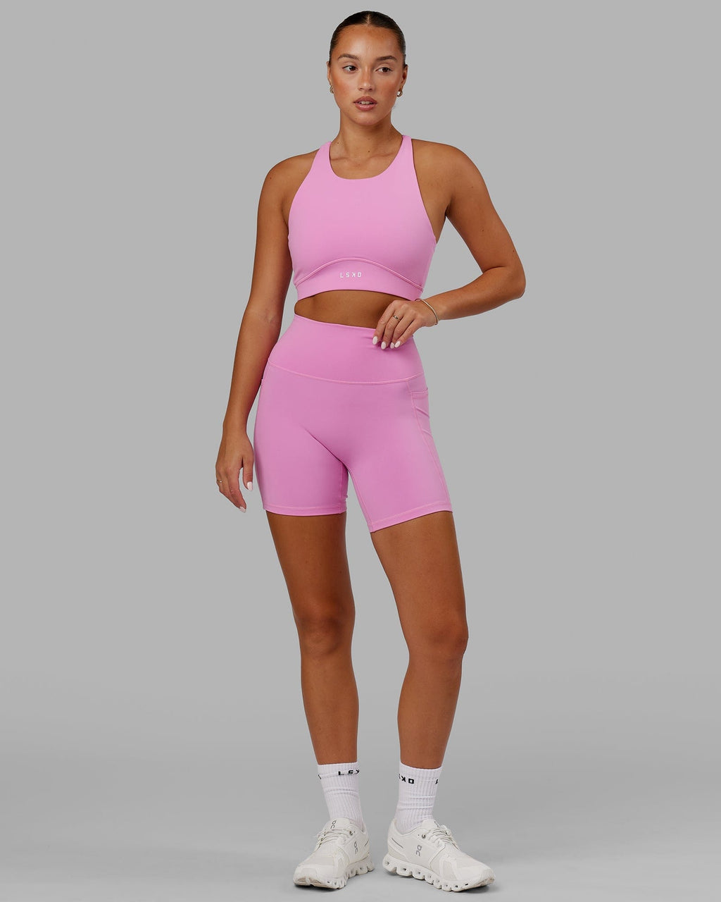 Model wearing Fusion Mid Short Tight - Spark Pink