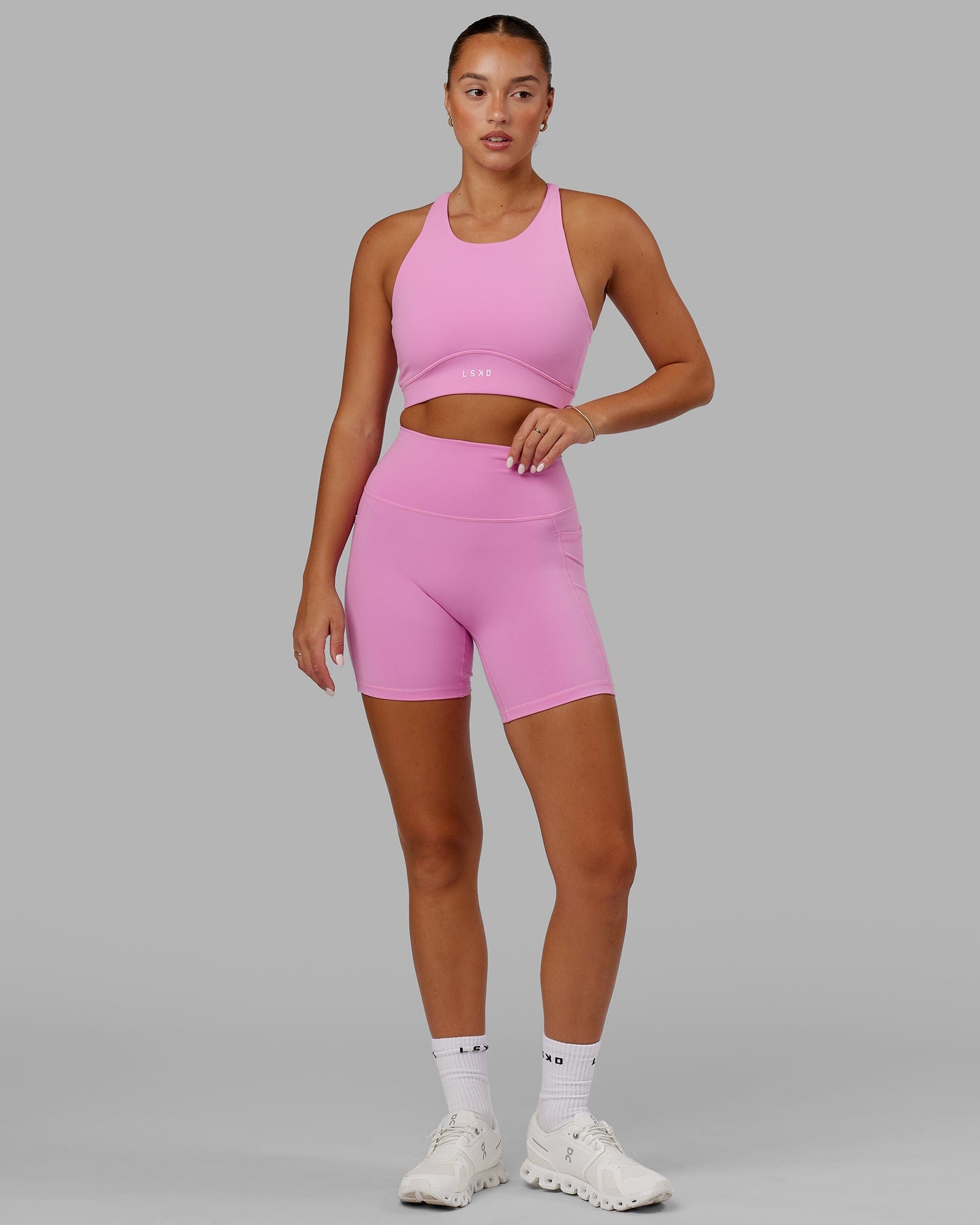 Model wearing Fusion Mid Short Tight - Spark Pink
