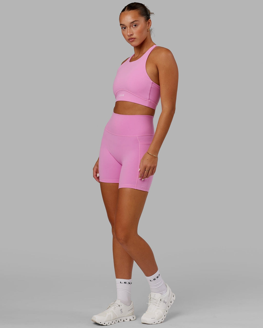 Model wearing Fusion Mid Short Tight - Spark Pink