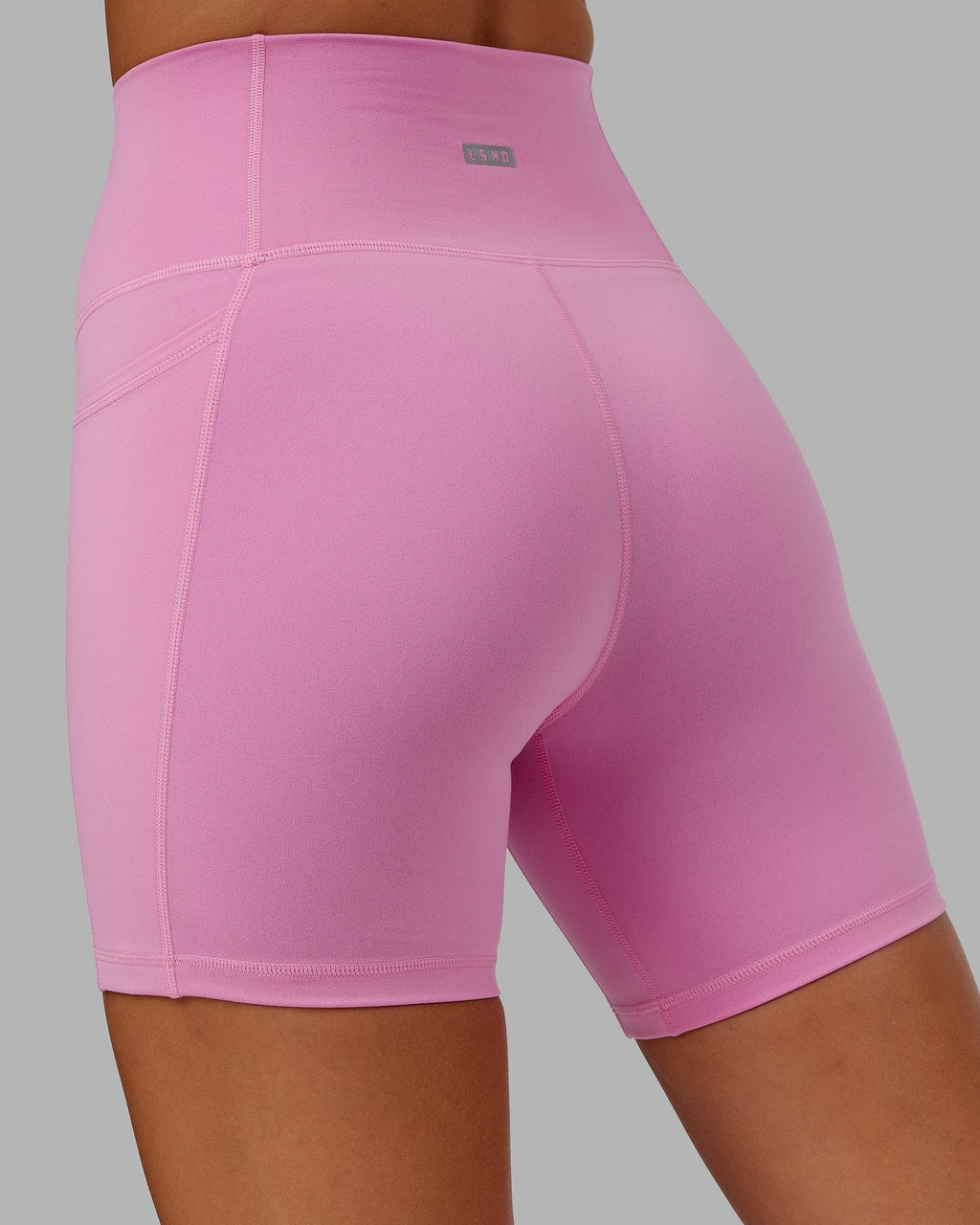Model wearing Fusion Mid Short Tight - Spark Pink