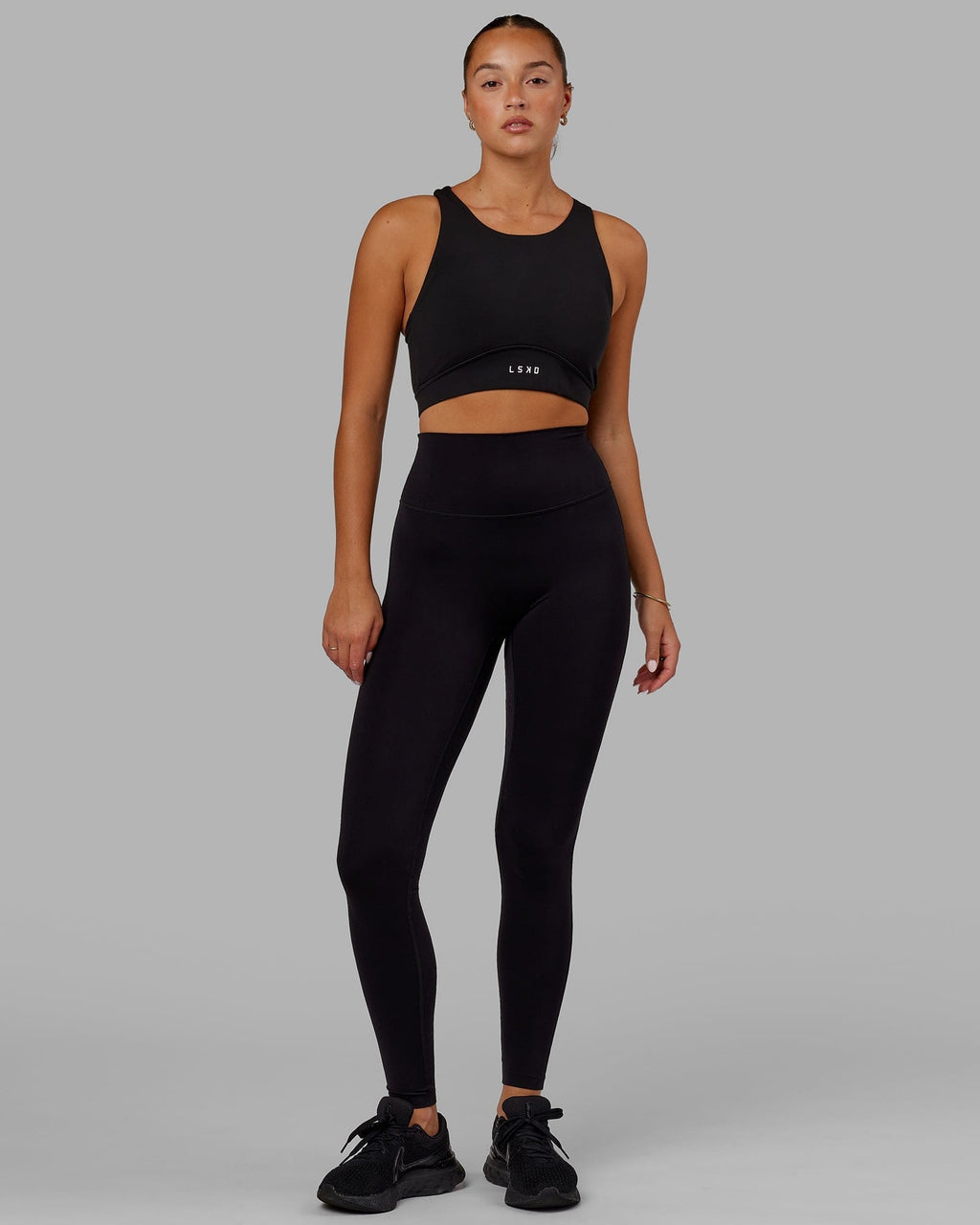 Model wearing Fusion Sports Bra - Black