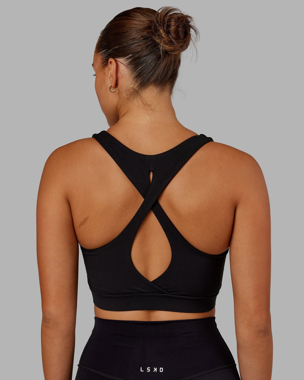 Model wearing Fusion Sports Bra - Black
