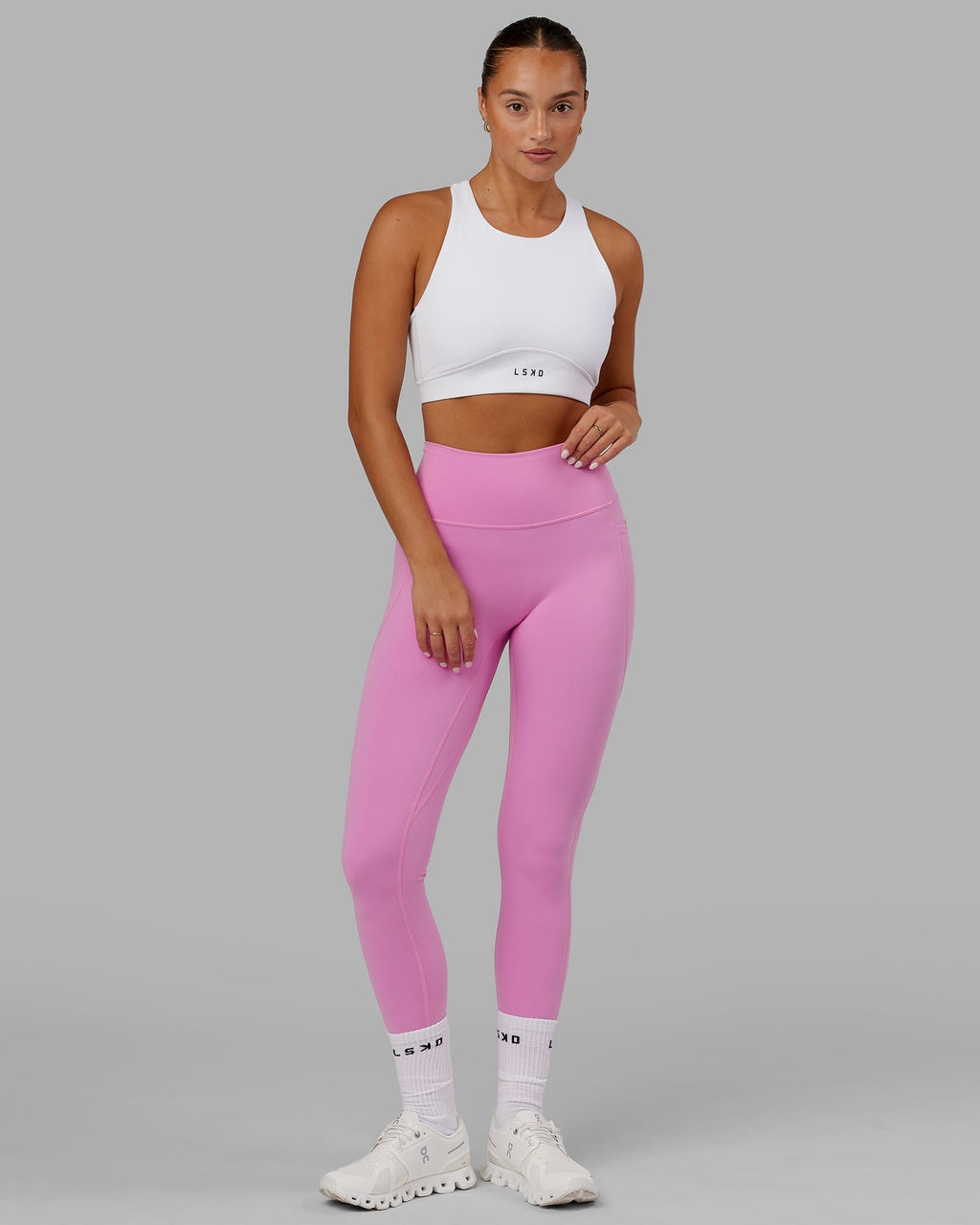 Model wearing Fusion Sports Bra - White