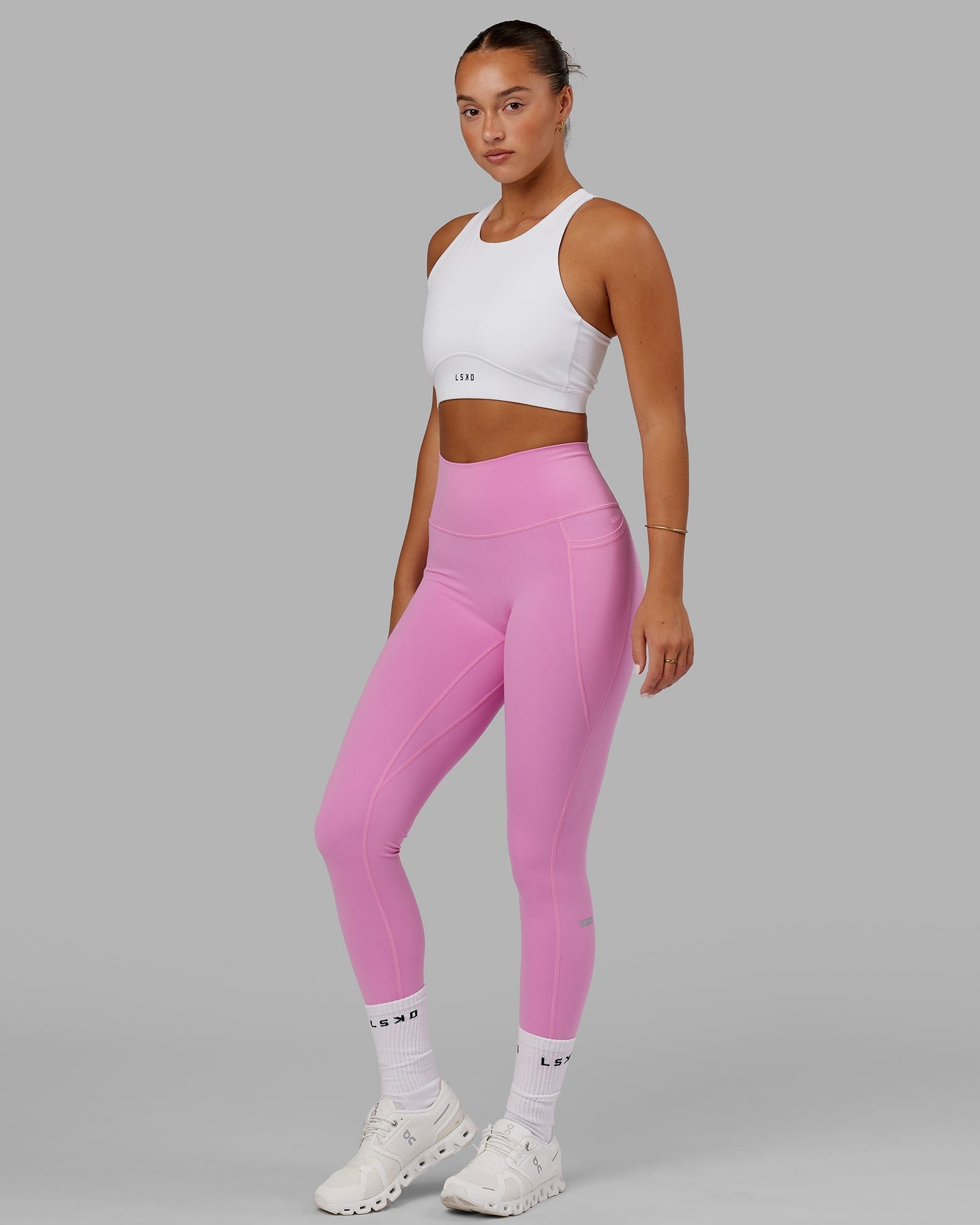 Model wearing Fusion Sports Bra - White