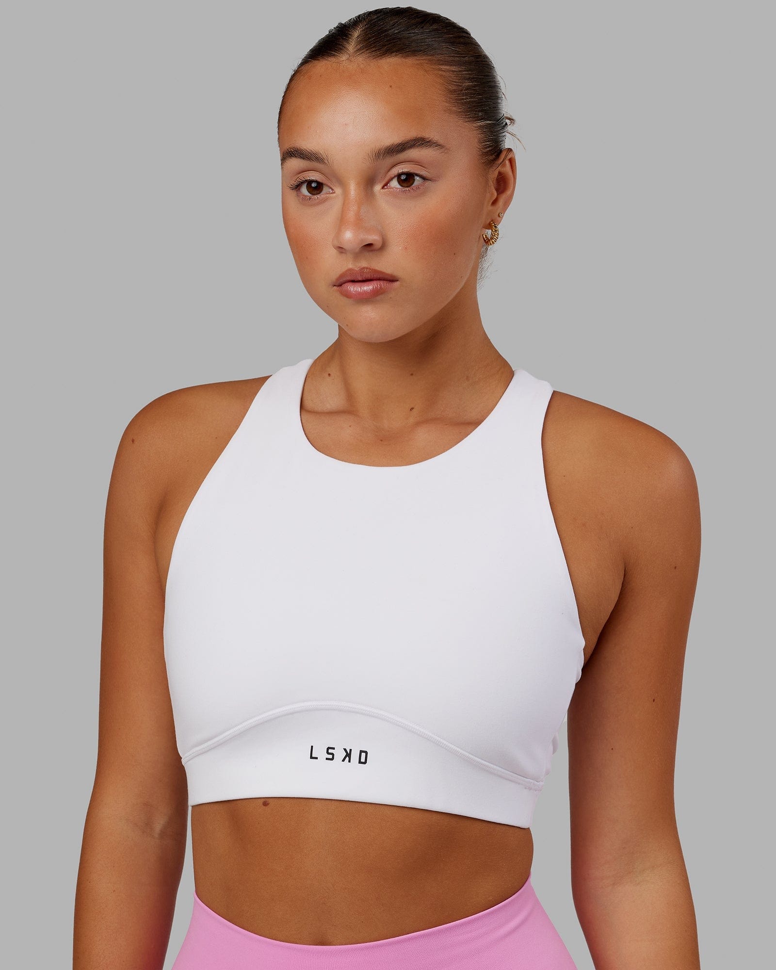 Model wearing Fusion Sports Bra - White