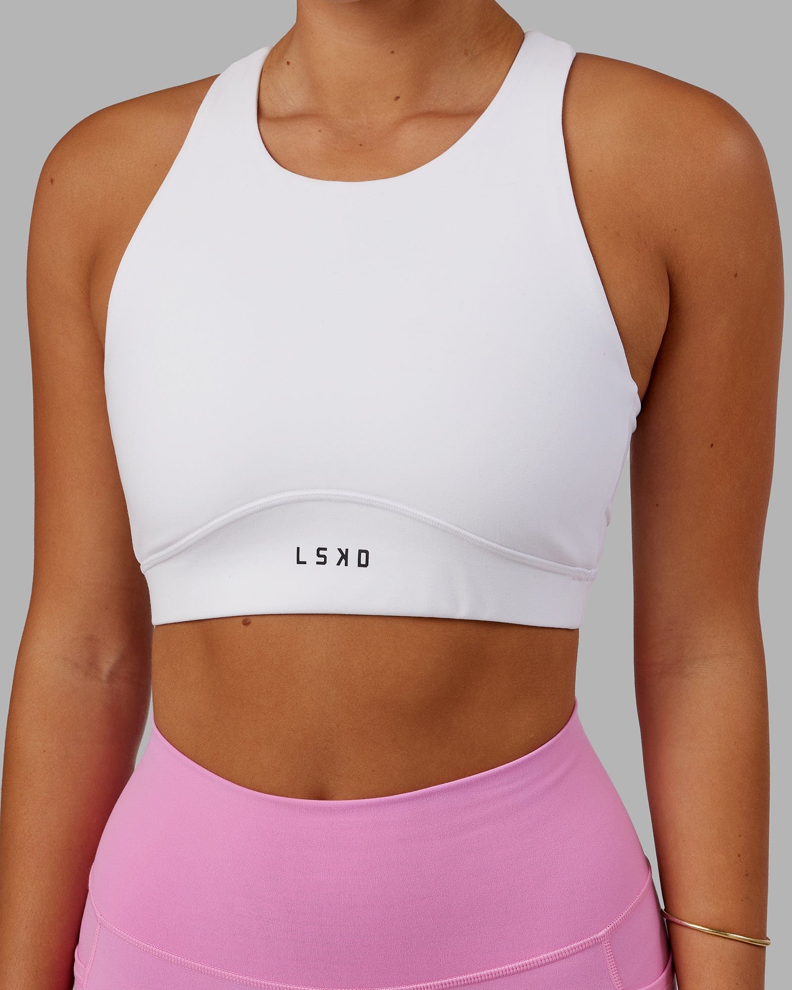 Model wearing Fusion Sports Bra - White