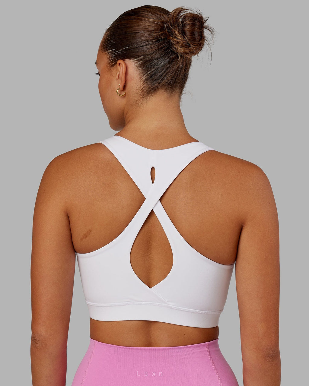 Model wearing Fusion Sports Bra - White