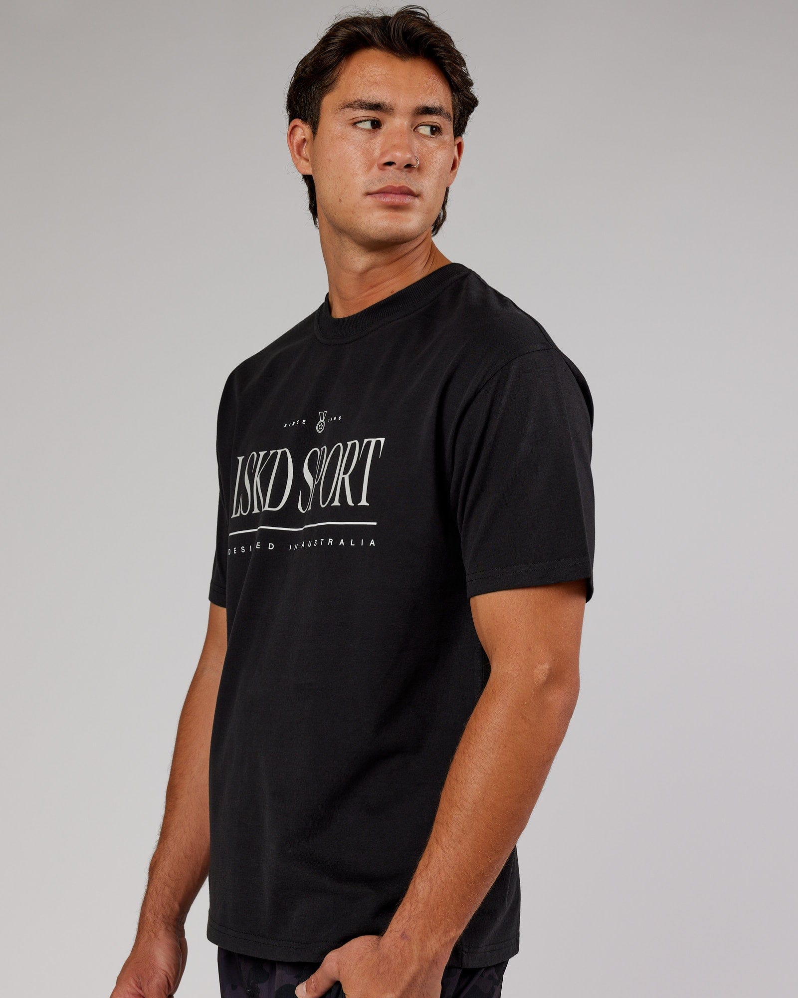 Model wearing Unisex Heritage Heavyweight Tee Oversize - Black-Beige