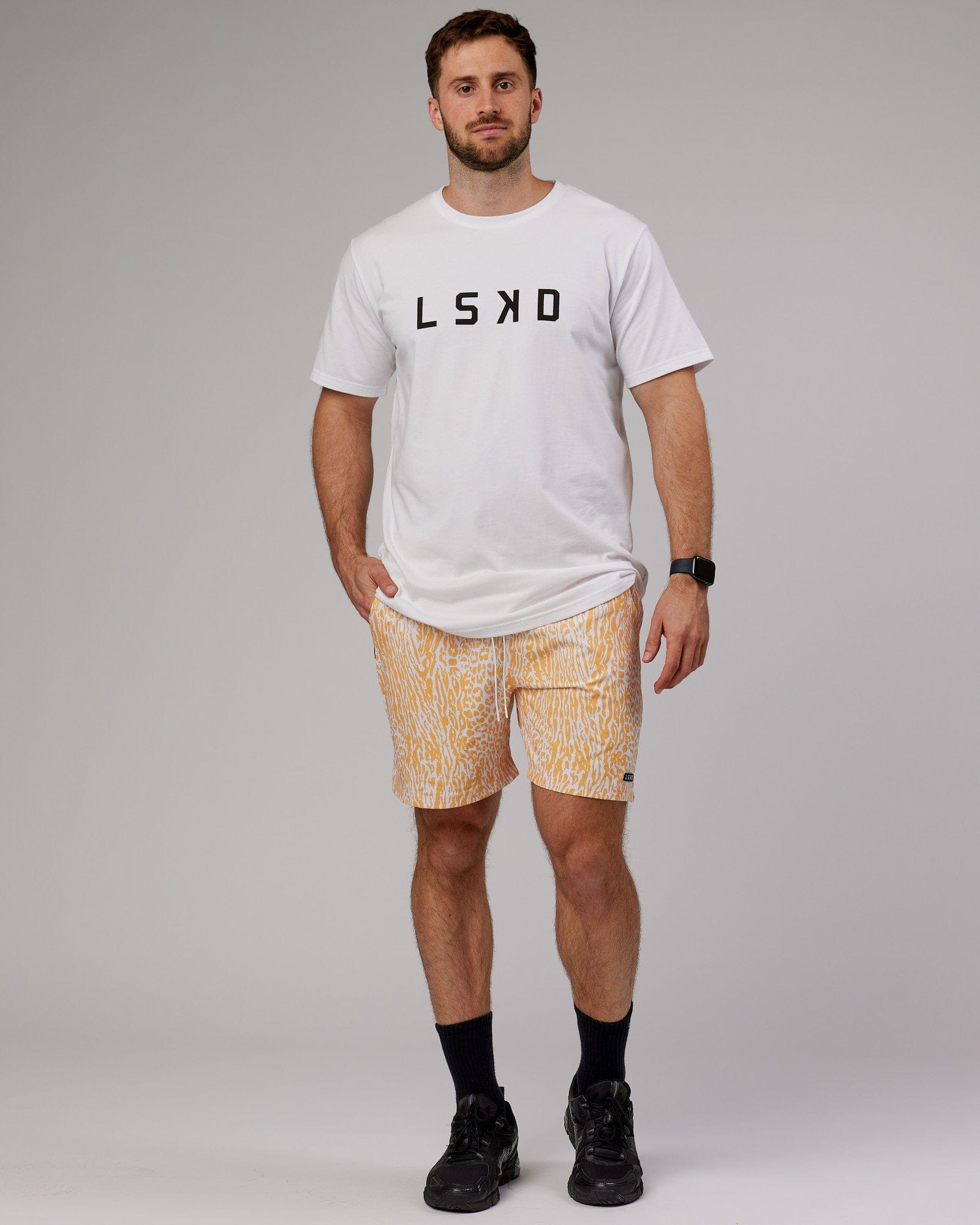 Model wearing Hunter 7" Performance Short - Warm Apricot