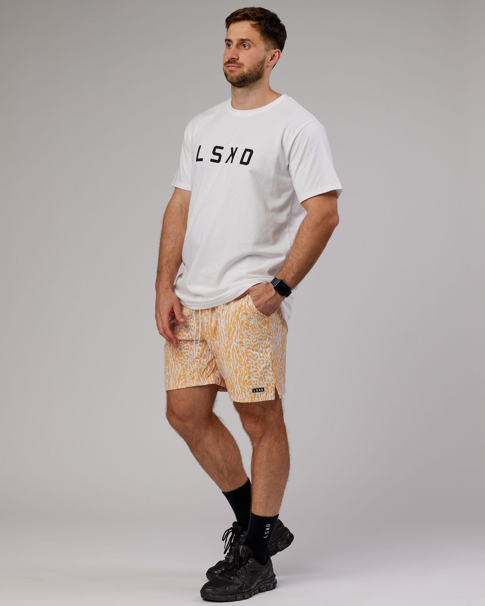 Model wearing Hunter 7" Performance Short - Warm Apricot