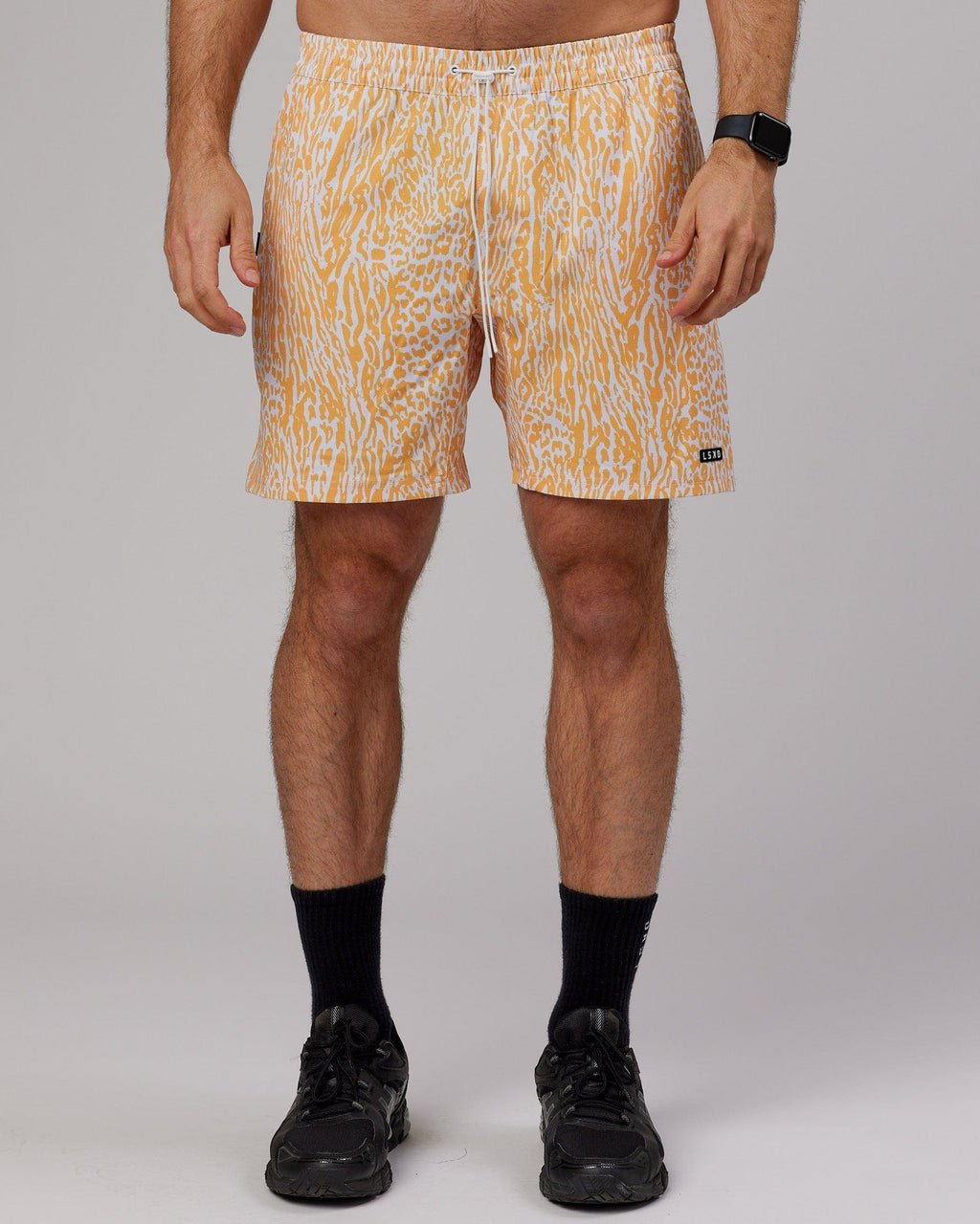 Model wearing Hunter 7" Performance Short - Warm Apricot