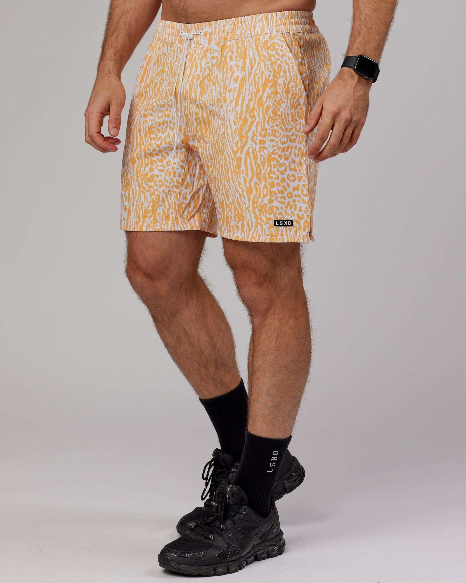 Model wearing Hunter 7" Performance Short - Warm Apricot