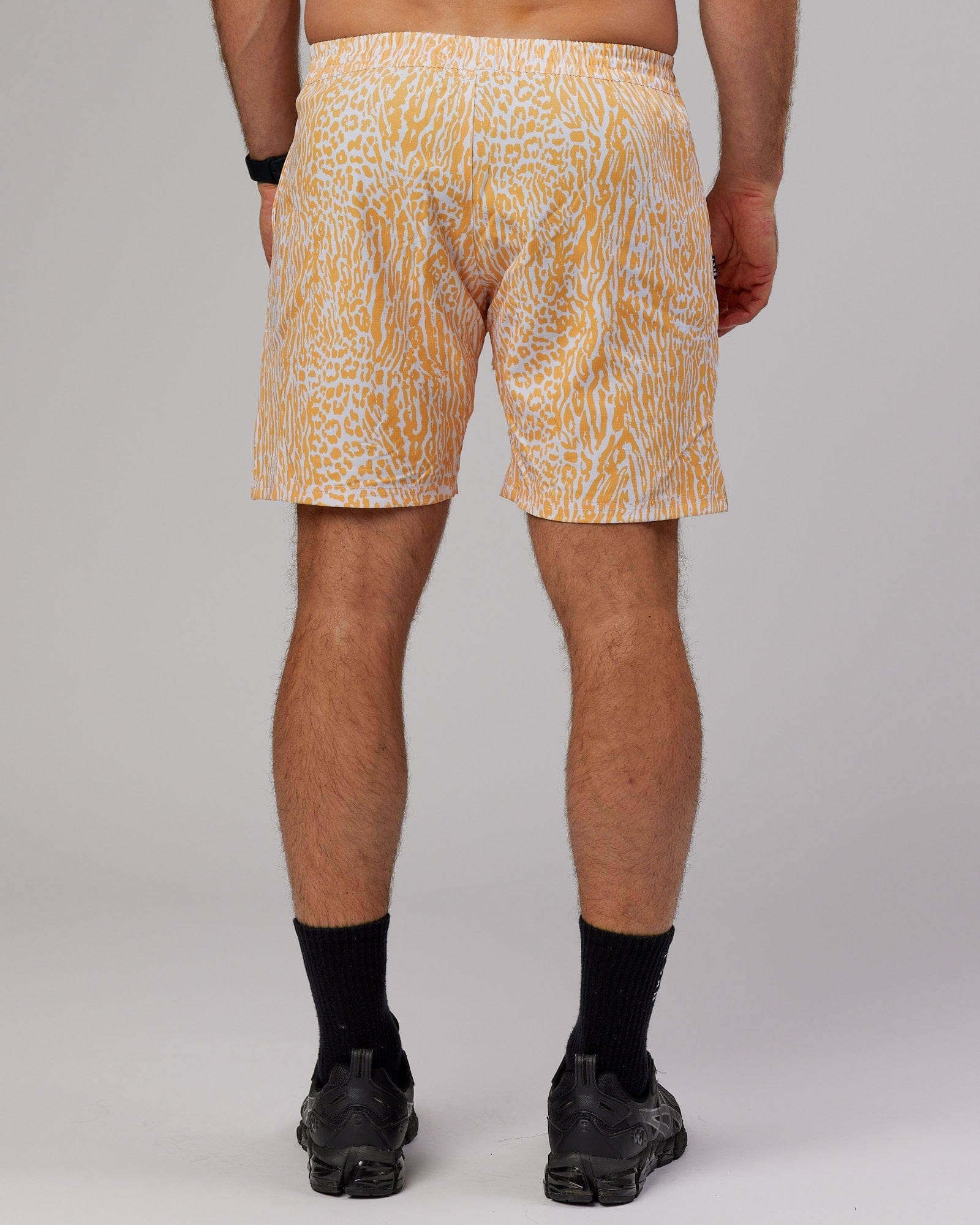 Model wearing Hunter 7" Performance Short - Warm Apricot