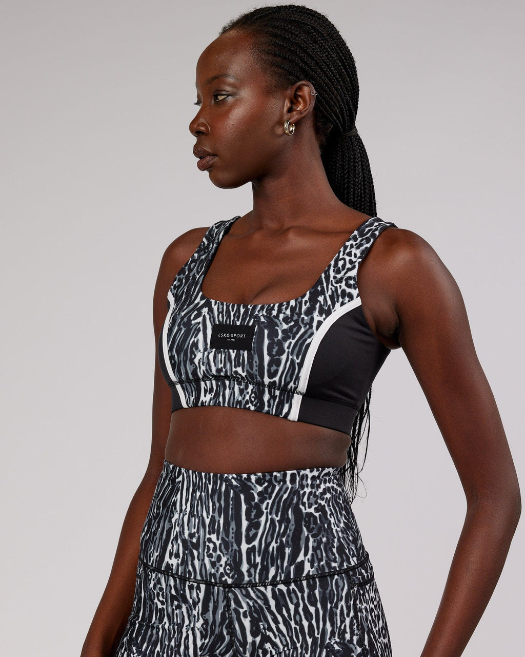 Model wearing Hunter Sports Bra - Night Leopard