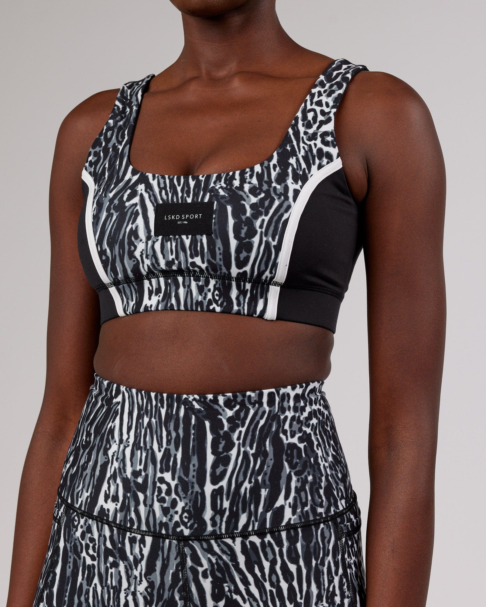 Model wearing Hunter Sports Bra - Night Leopard