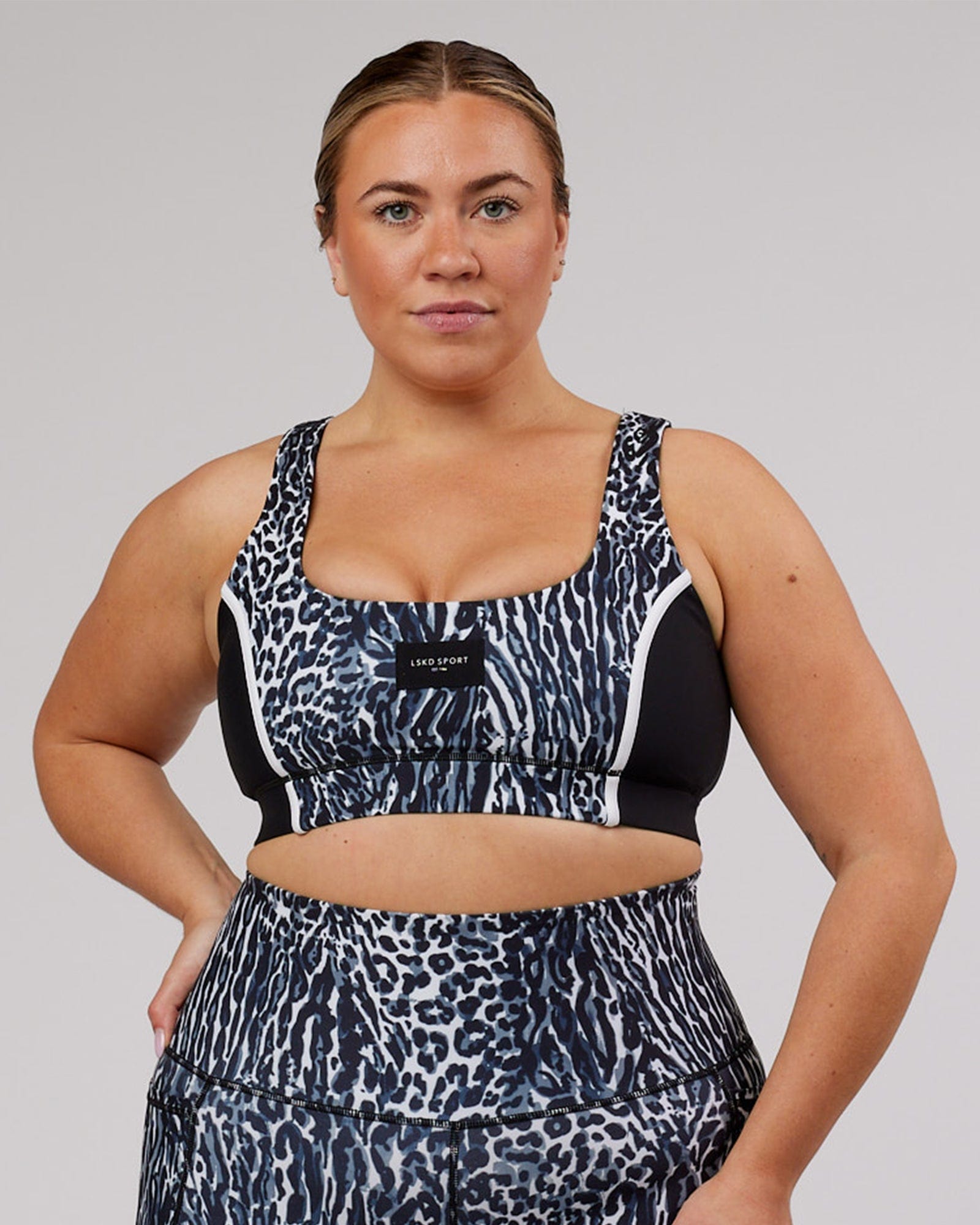 Model wearing Hunter Sports Bra - Night Leopard